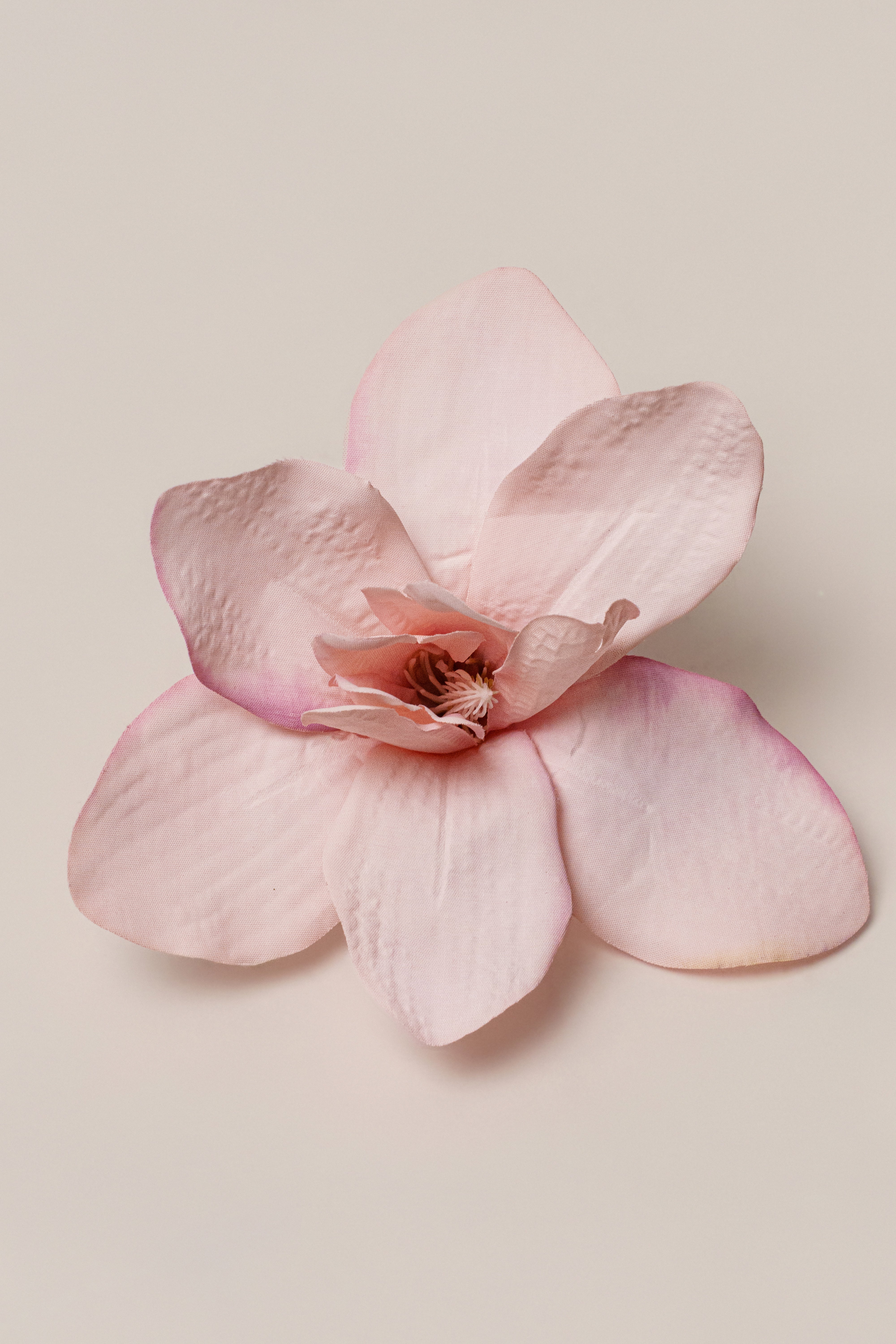 Light pink coastal orchid hair clip by JLUXLABEL, decorative accessory with floral design for hair styling.