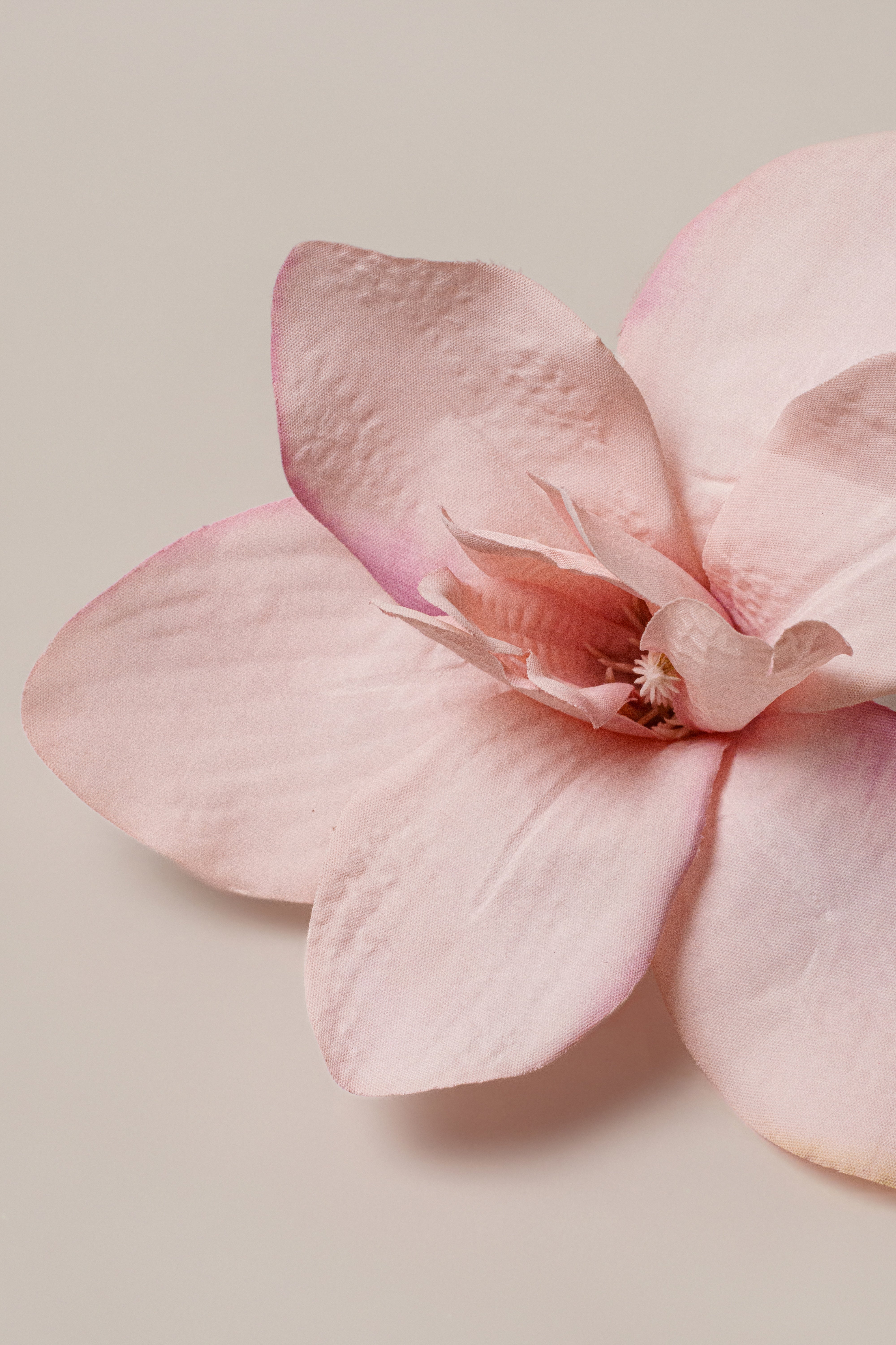 Light pink coastal orchid hair clip by JLUXLABEL, featuring a delicate floral design perfect for accessories and styling.