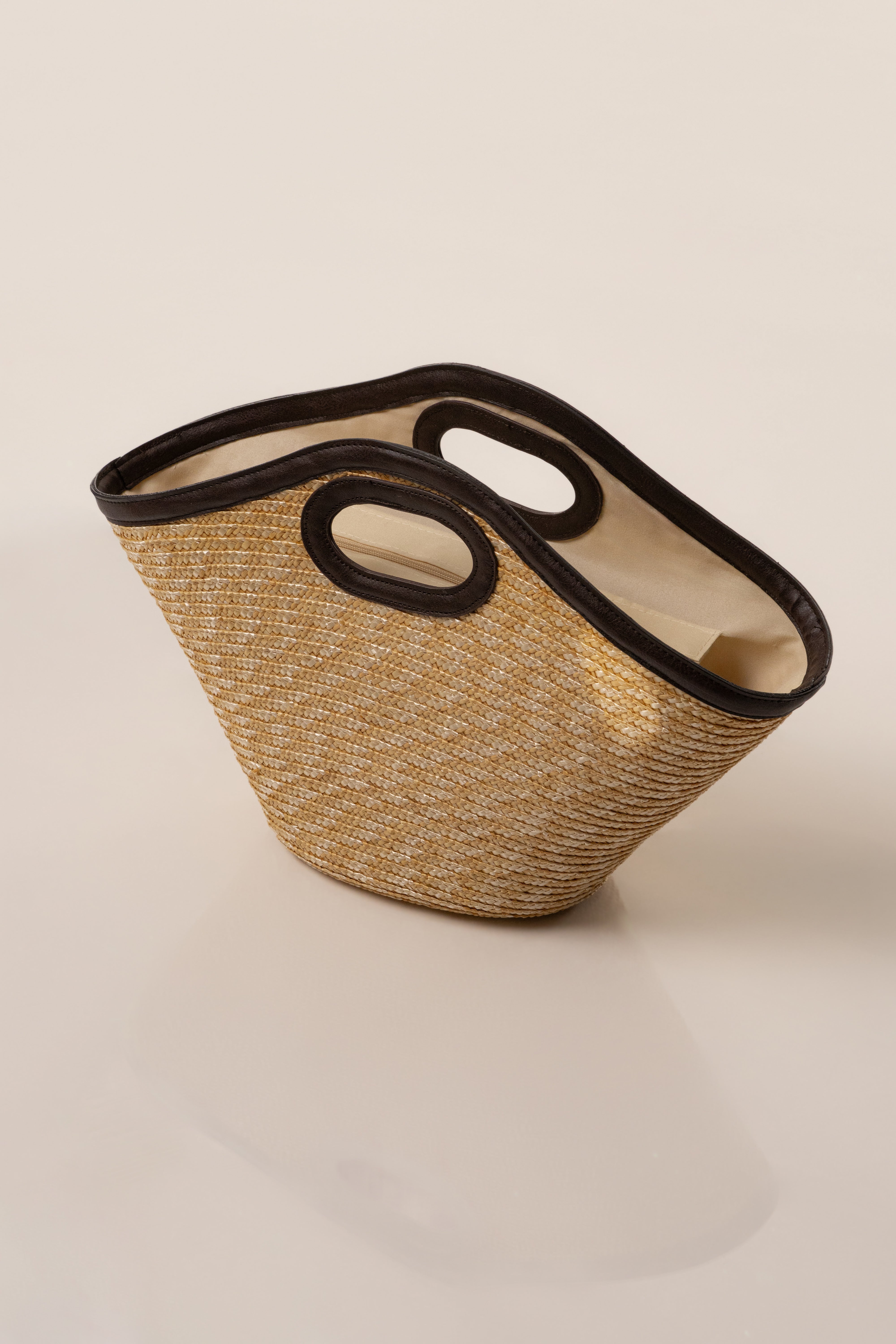 Natural Santorini straw tote bag by JLUXLABEL, showcasing woven straw material and sturdy handles, perfect for accessories and casual outings.