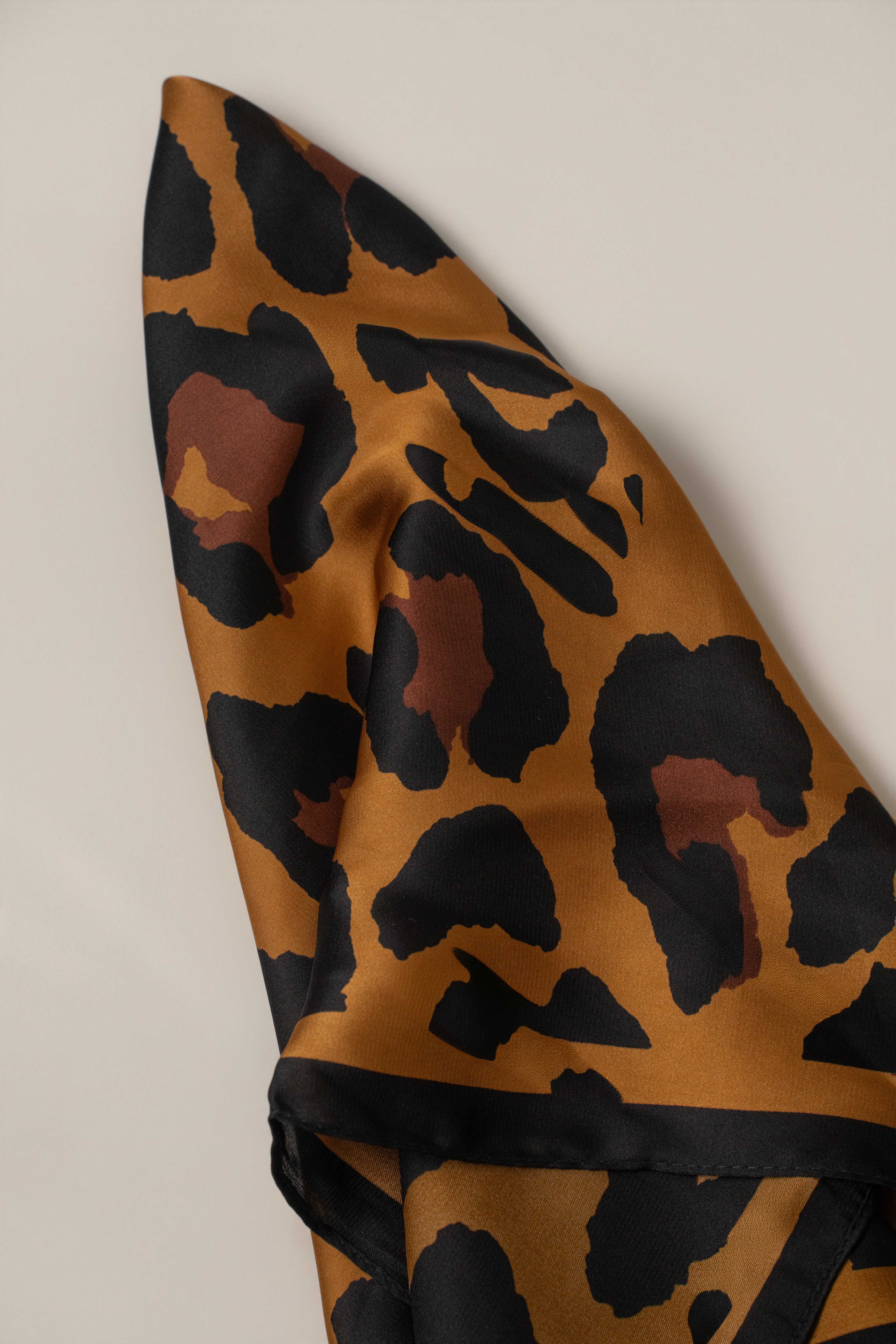 Brown Bold Nature scarf from JLUXLABEL accessories collection, featuring a textured fabric and versatile style.