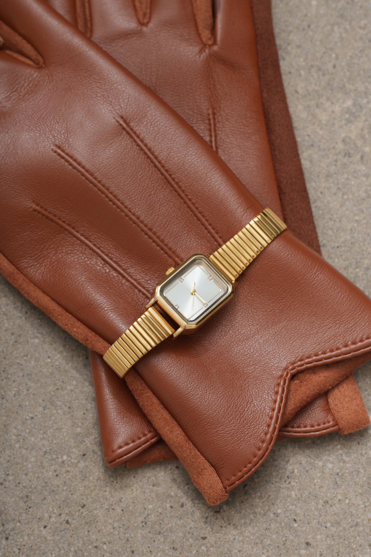 Gold London Watch from JLUXLABEL, featuring a sleek jewelry design with a gold-tone strap and classic round face.