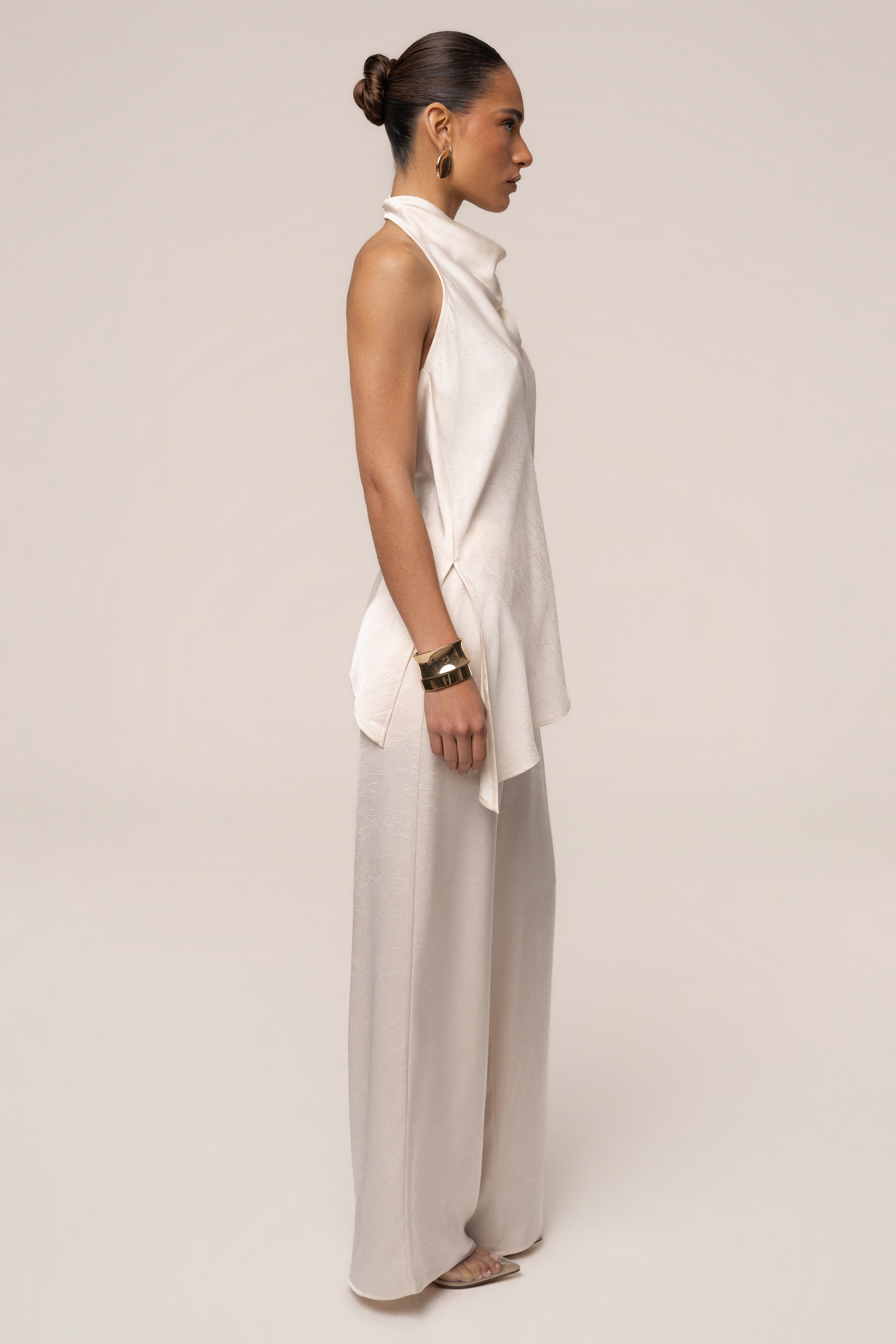 Cream satin pant set with draped top from JLUXLABEL, featuring a sleek, elegant design perfect for stylish occasions.
