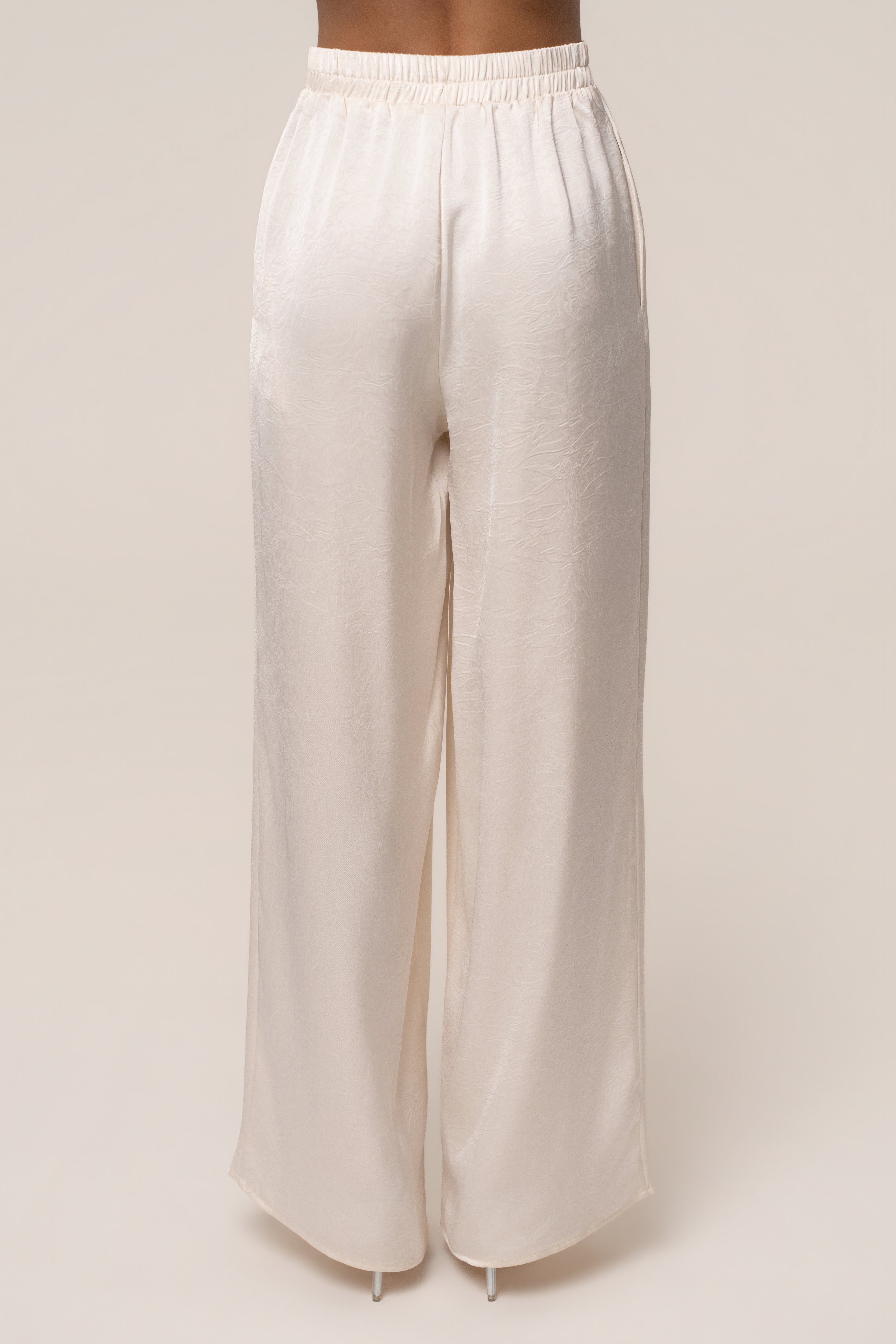 Cream satin pant set with draped design from JLUXLABEL, featuring a stylish and elegant two-piece outfit for women.