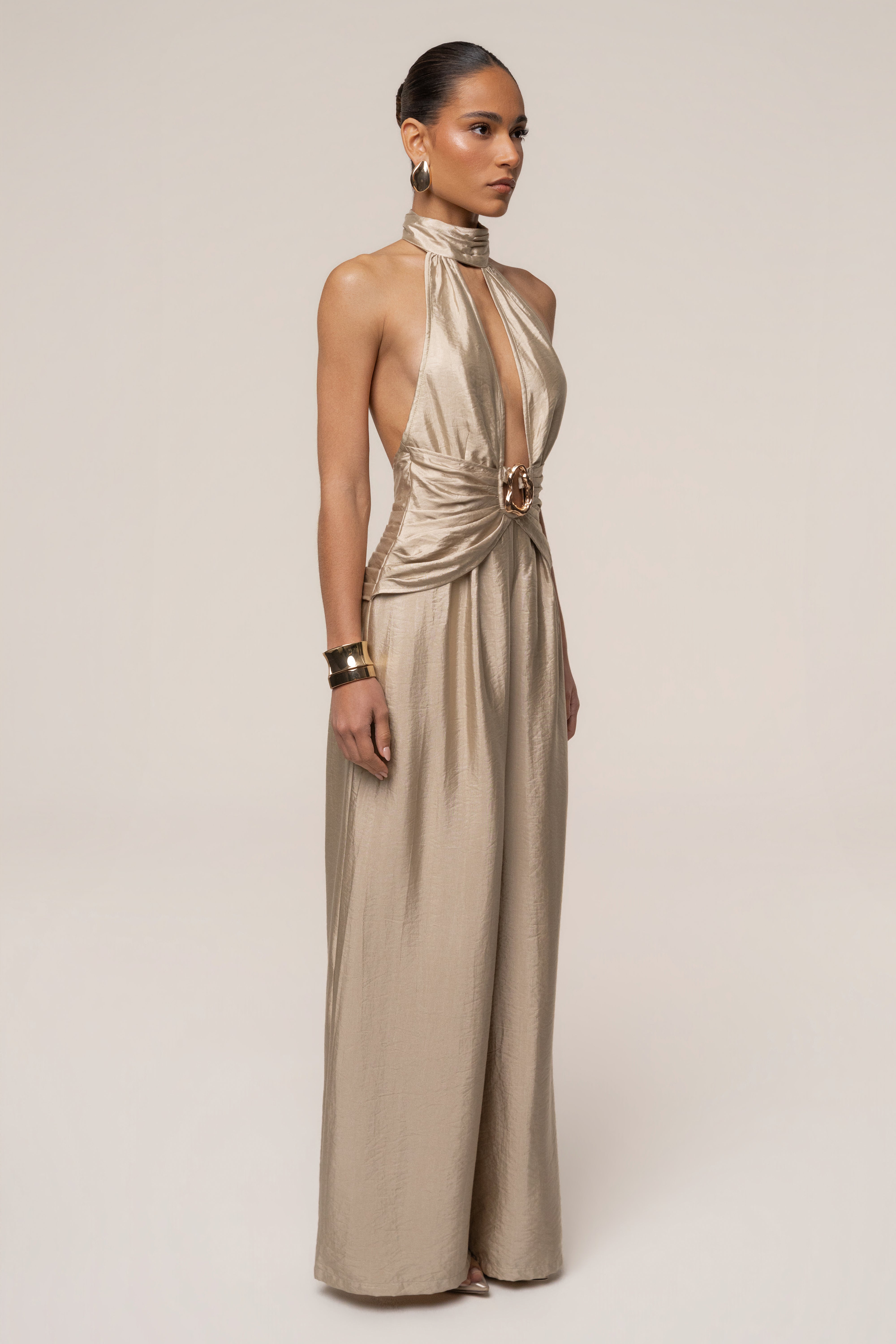Gold accent JLUXLABEL jumpsuit featuring a stylish design, visible gold details, and a flattering fit.