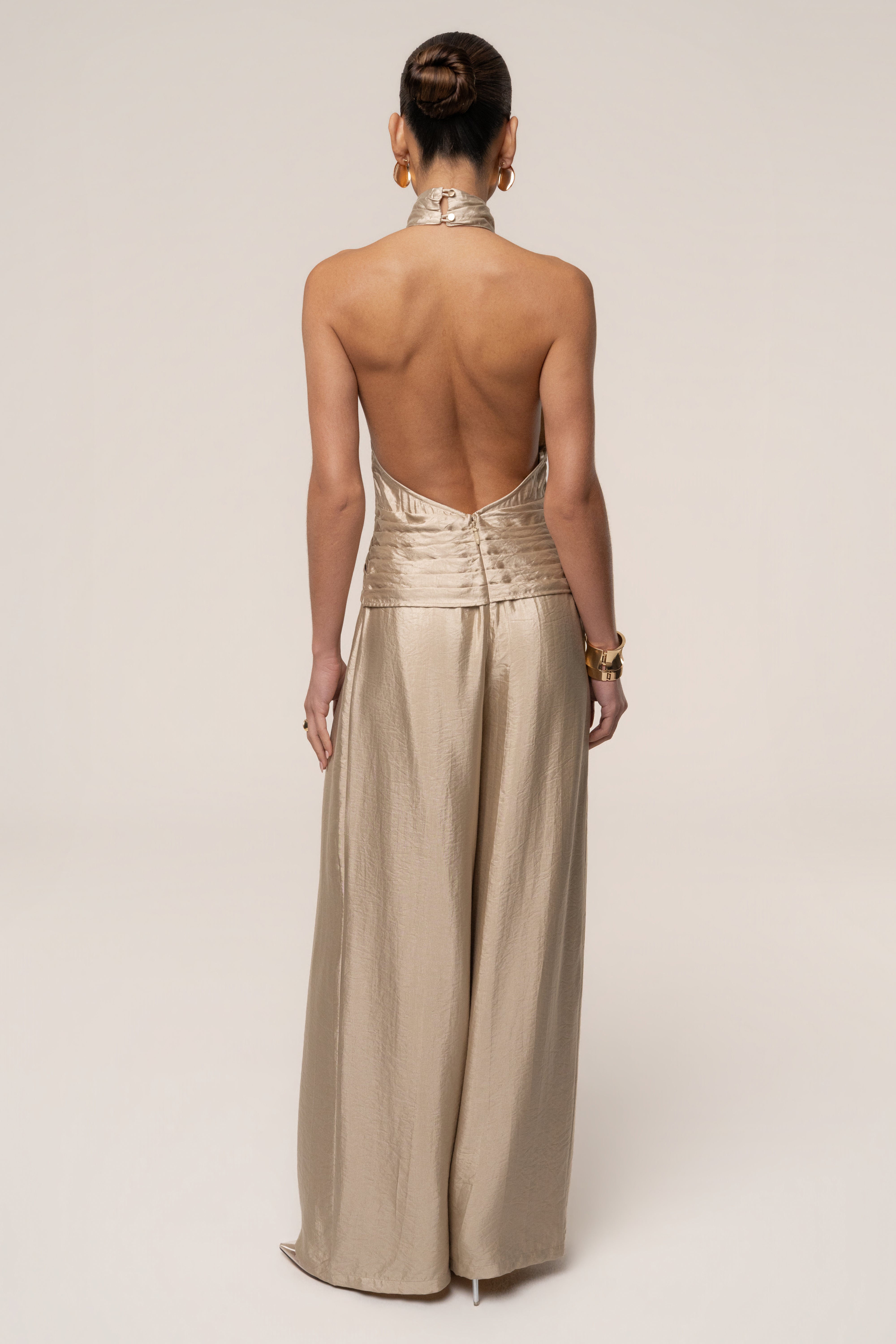 Gold accent JLUXLABEL jumpsuit with a sleek design, featuring elegant gold details and modern style.