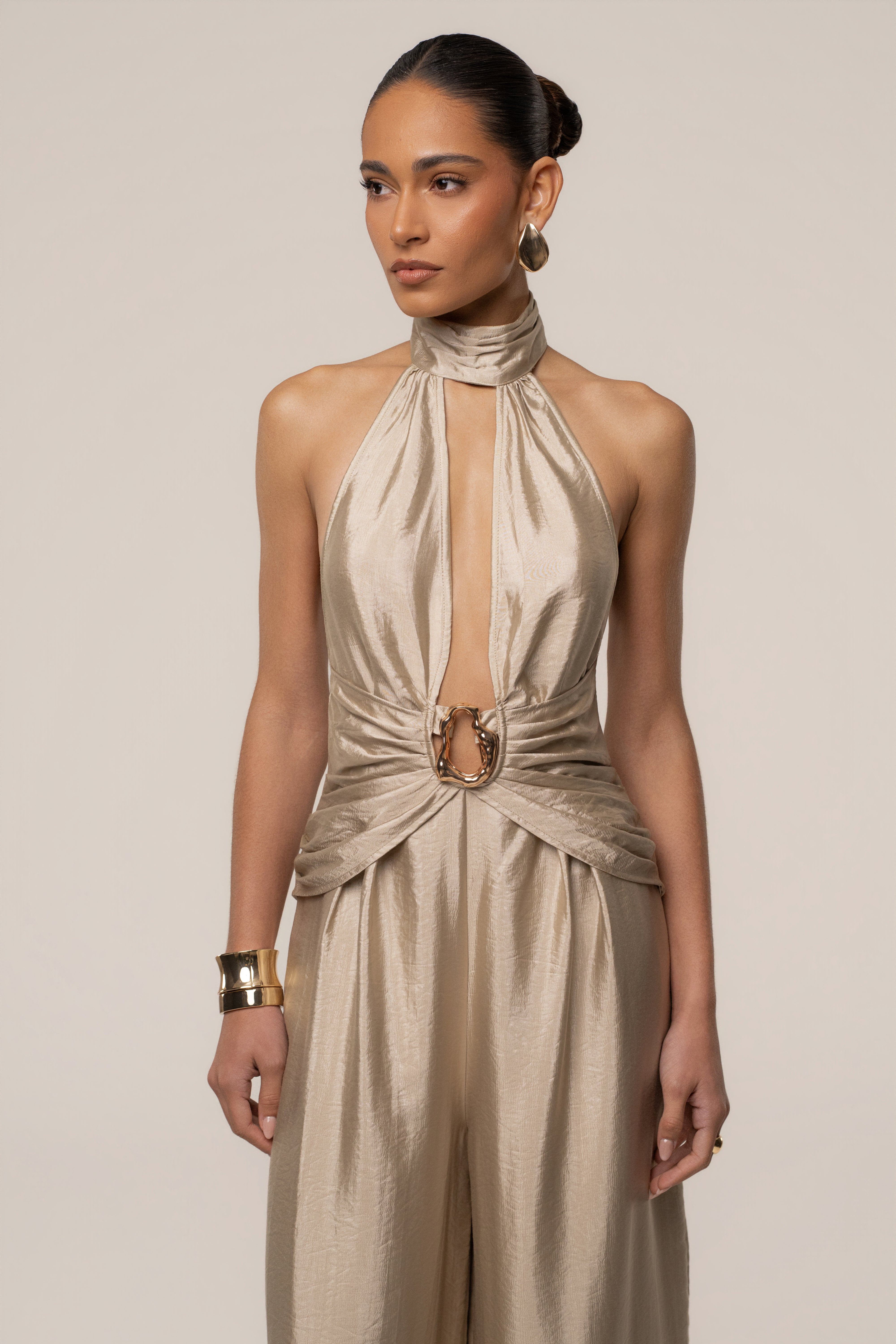Gold accent JLUXLABEL jumpsuit with stylish design, featuring a fitted silhouette and elegant details.