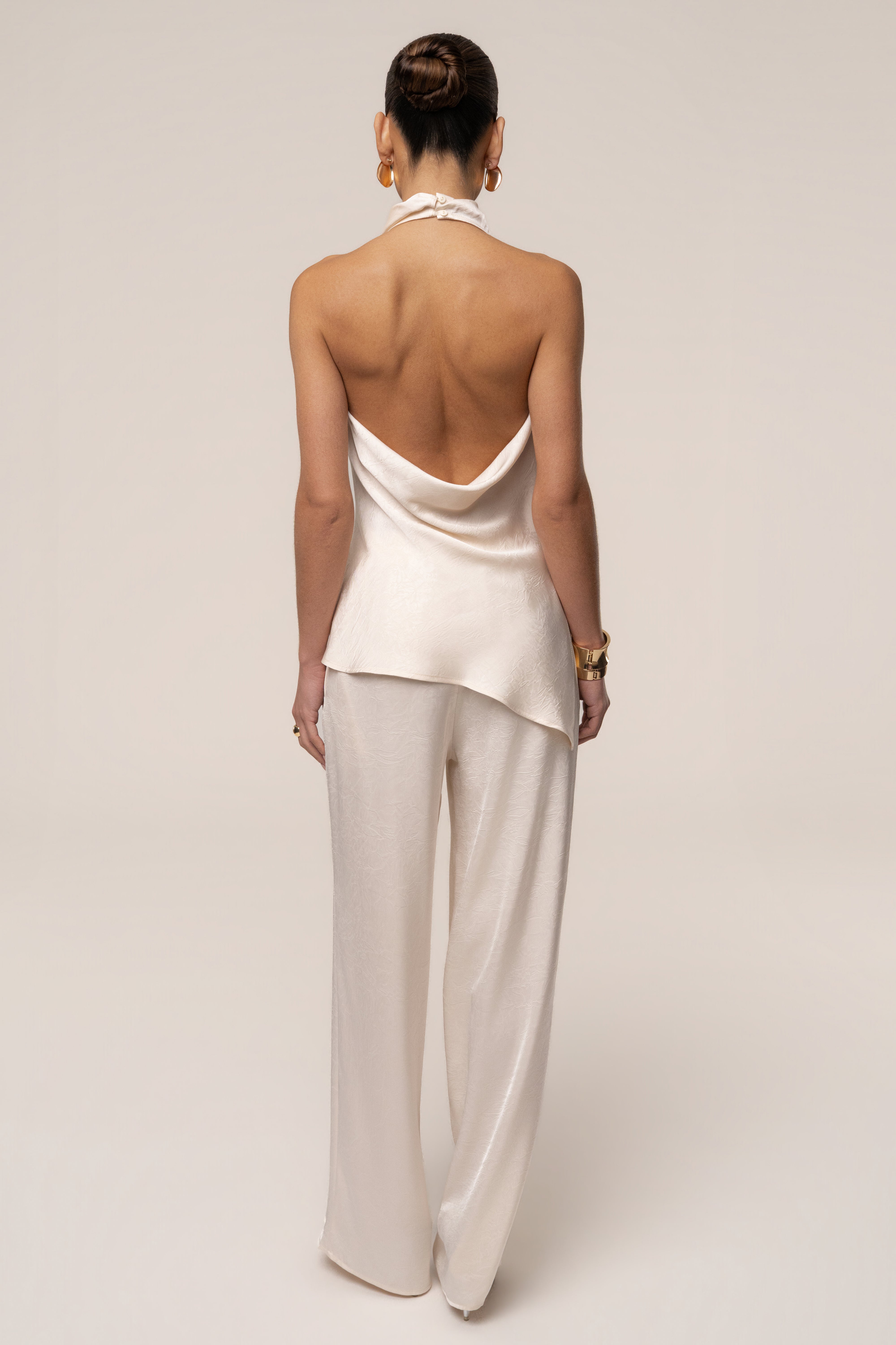 Cream satin pant set with draped design from JLUXLABEL, featuring a stylish and elegant matching top and pants ensemble.