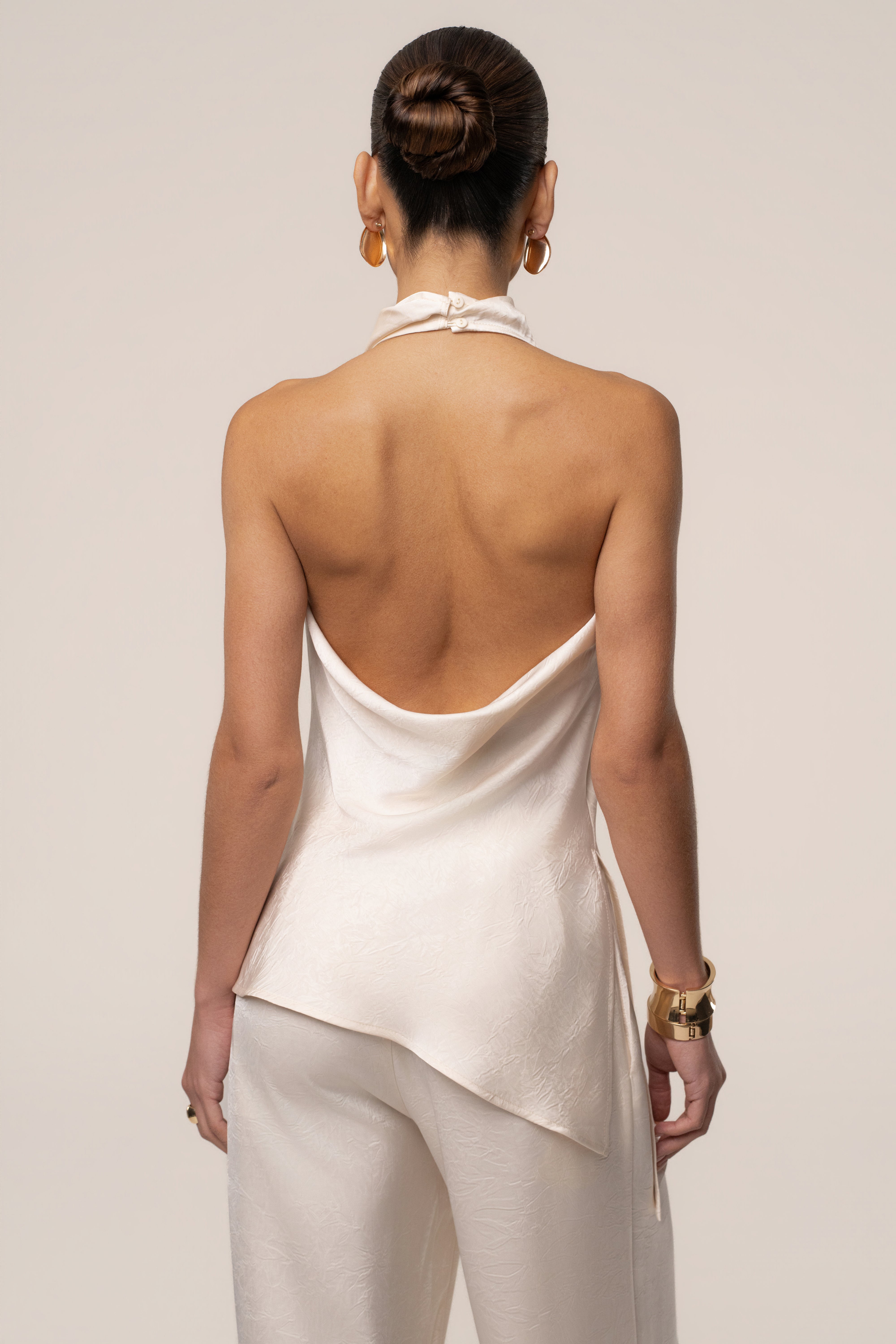Cream satin pant set with draped design from JLUXLABEL, featuring a stylish and elegant matching top and pants ensemble.