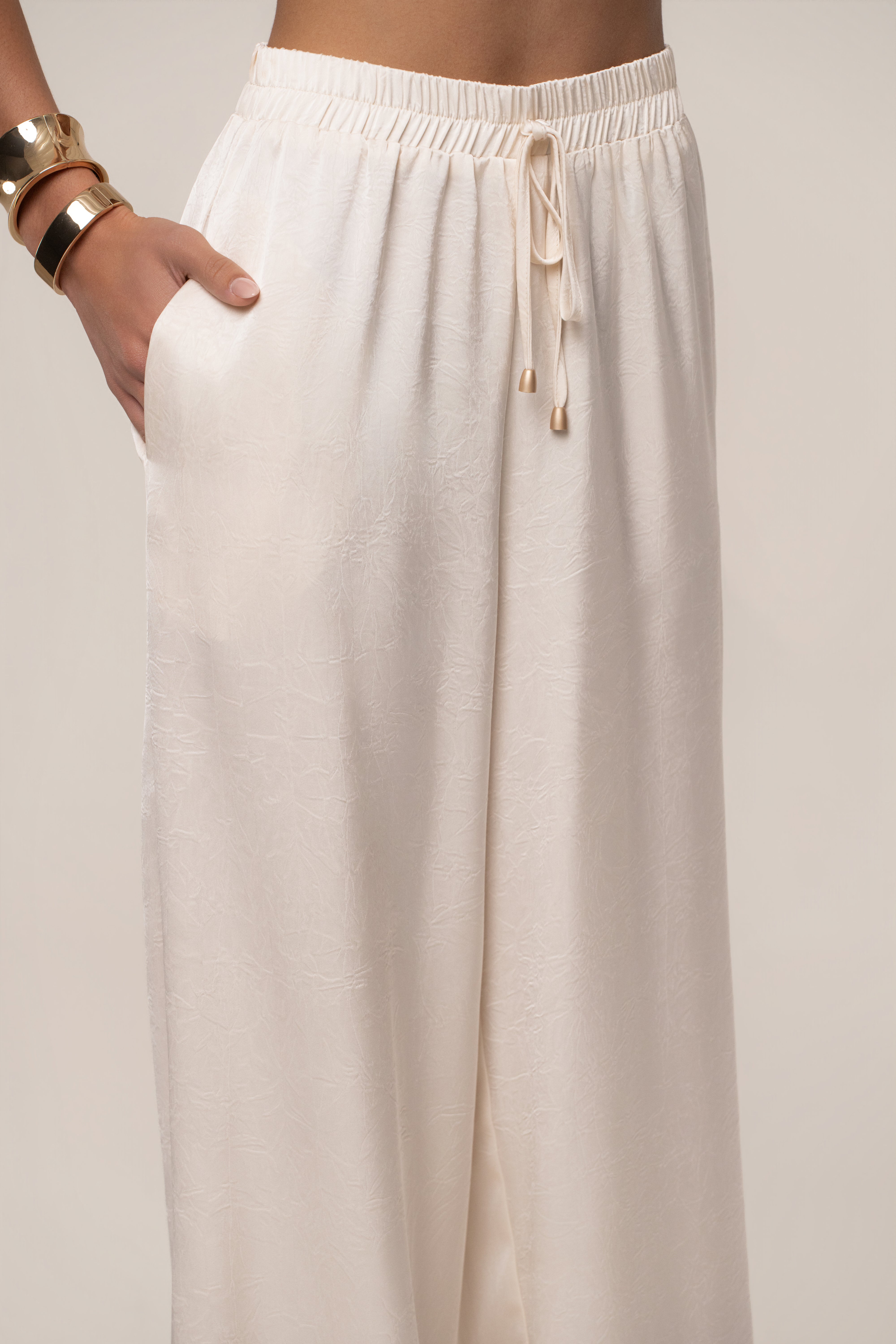 Cream satin pant set with draped design from JLUXLABEL, featuring a stylish, elegant look perfect for chic occasions.