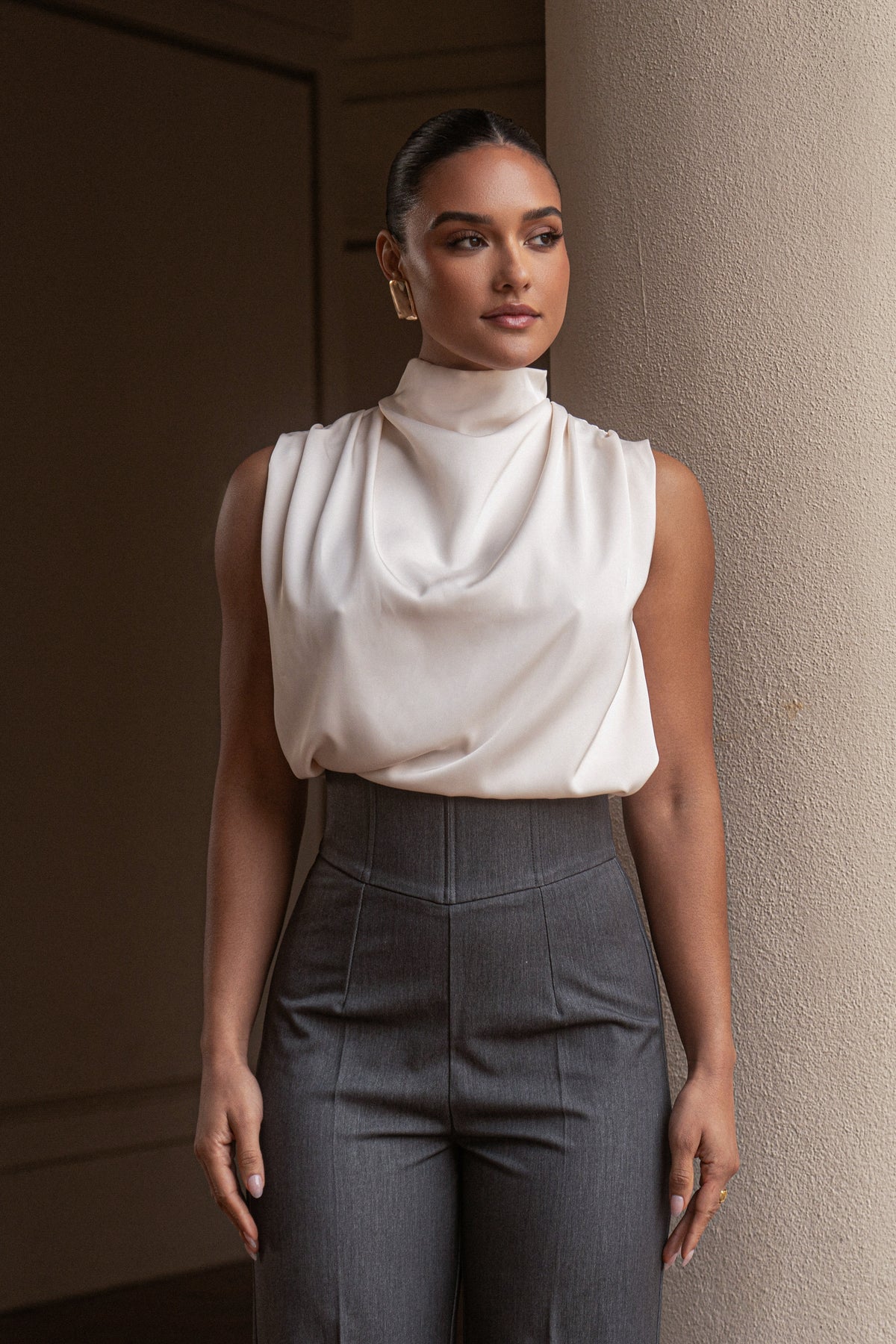 JLUXLABEL Buttercream Desiree Mock Neck Top, stylish cream-colored long-sleeve top with a fitted mock neck design.