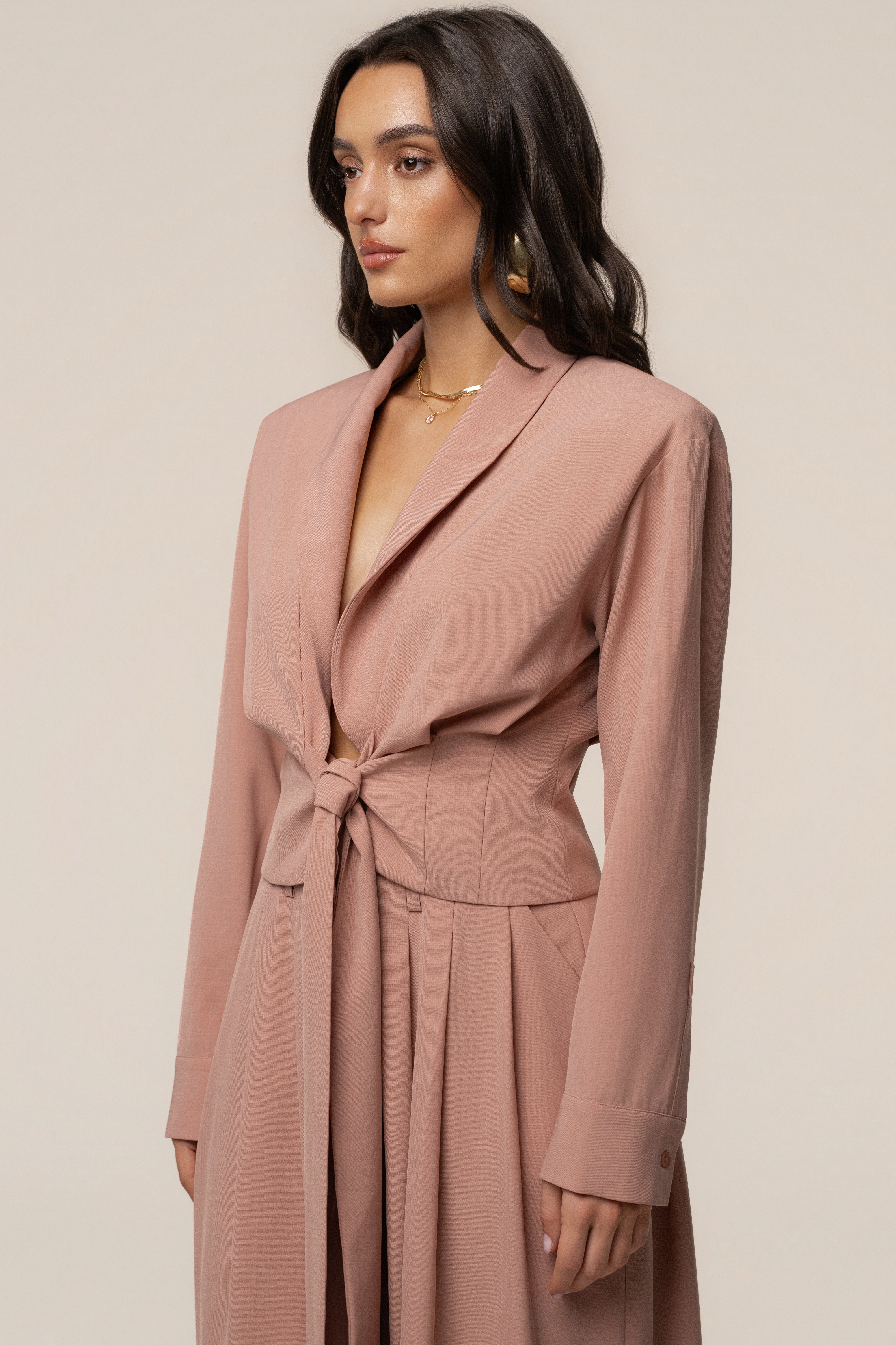 Mauve JLUXLABEL Estate wrap top with long sleeves and V-neck, styled on a model showcasing its fitted design and soft fabric.