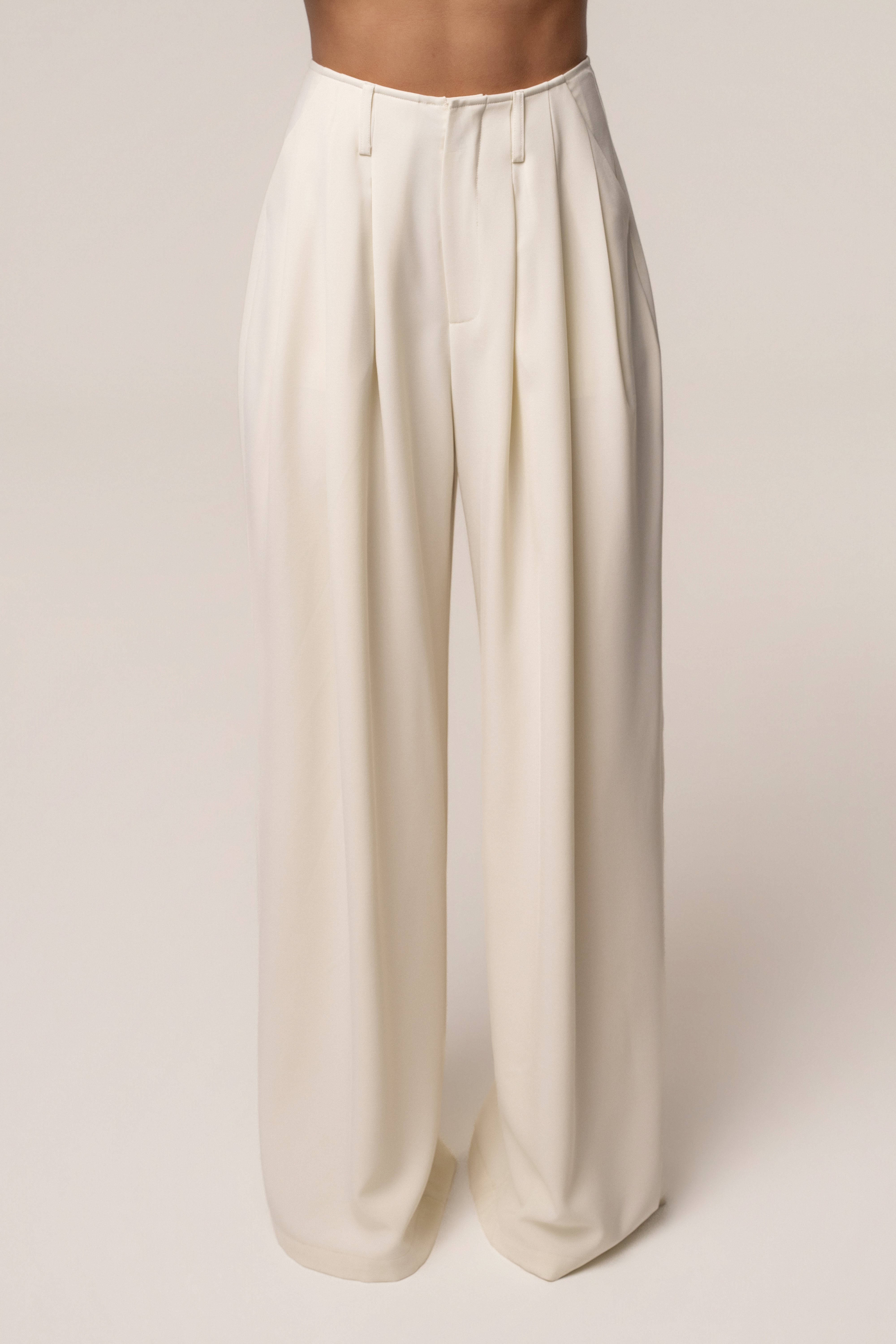 Cream estate pleated trouser from JLUXLABEL, stylish bottoms with a tailored fit and pleated design, perfect for sophisticated outfits.