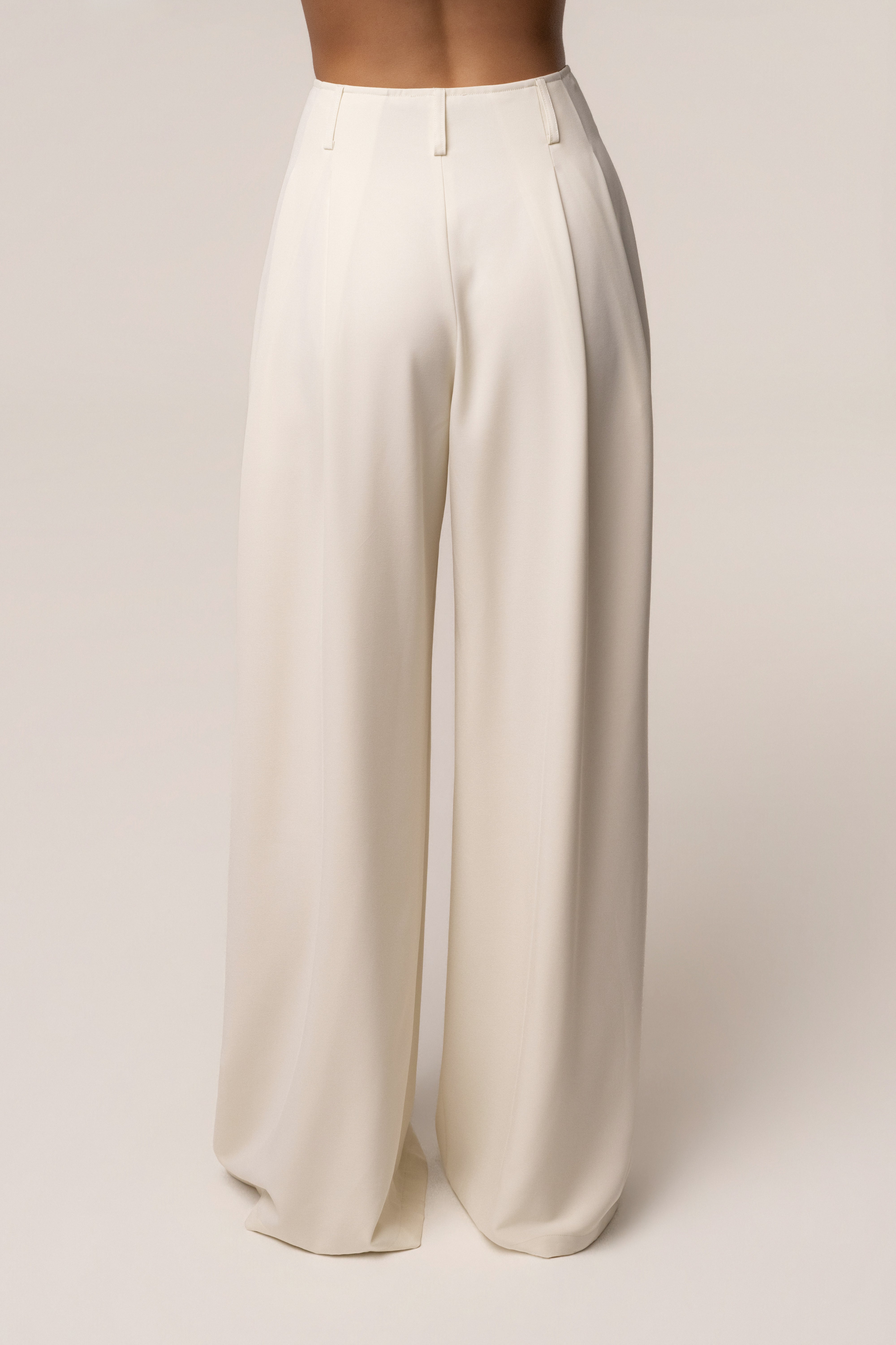 Cream Estate Pleated Trouser from JLUXLABEL, stylish bottoms with pleats, tailored fit, and lightweight fabric.