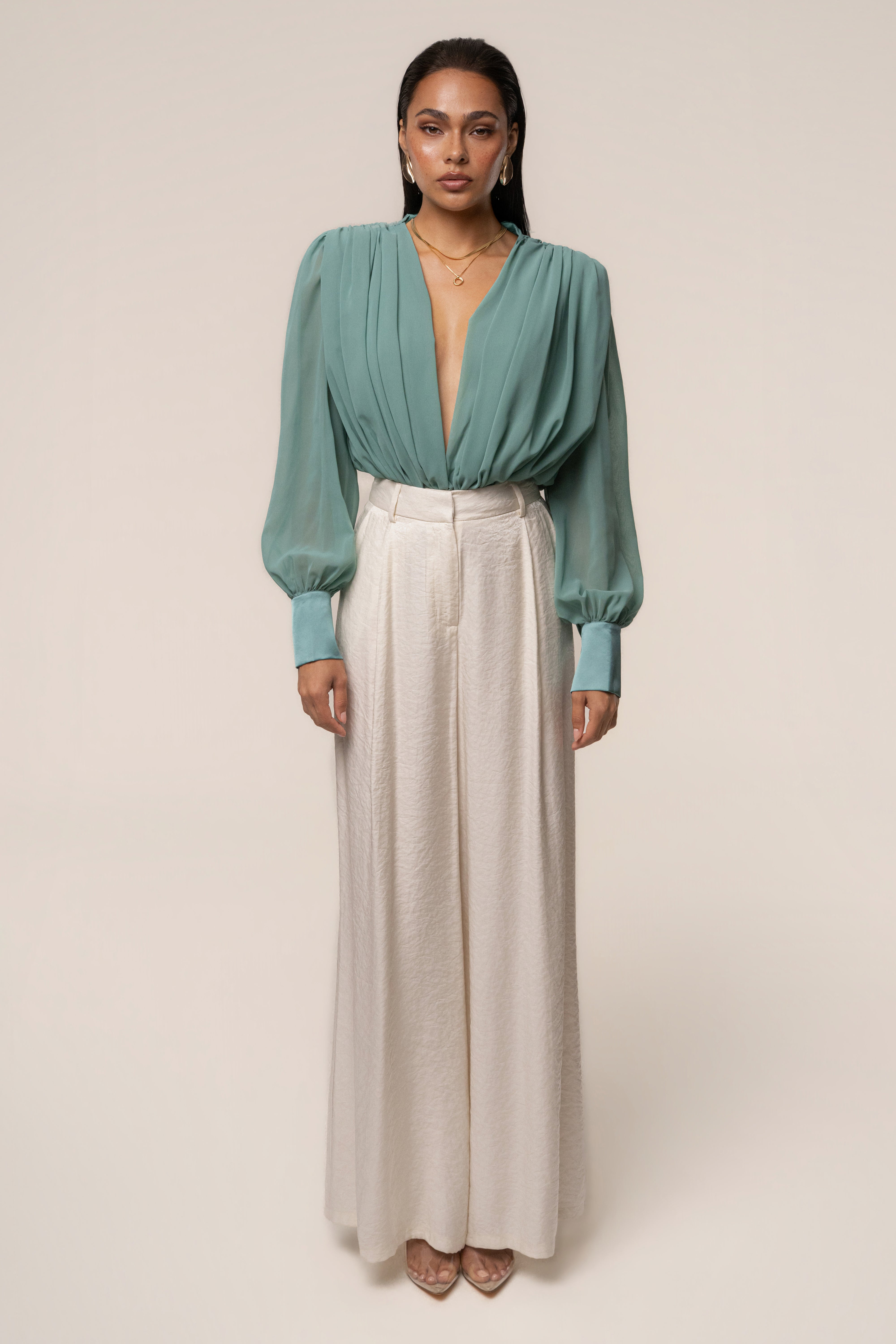 Teal JLUXLABEL pleated chiffon top with a relaxed fit and elegant design, showcasing its lightweight, flowy fabric and tailored details.
