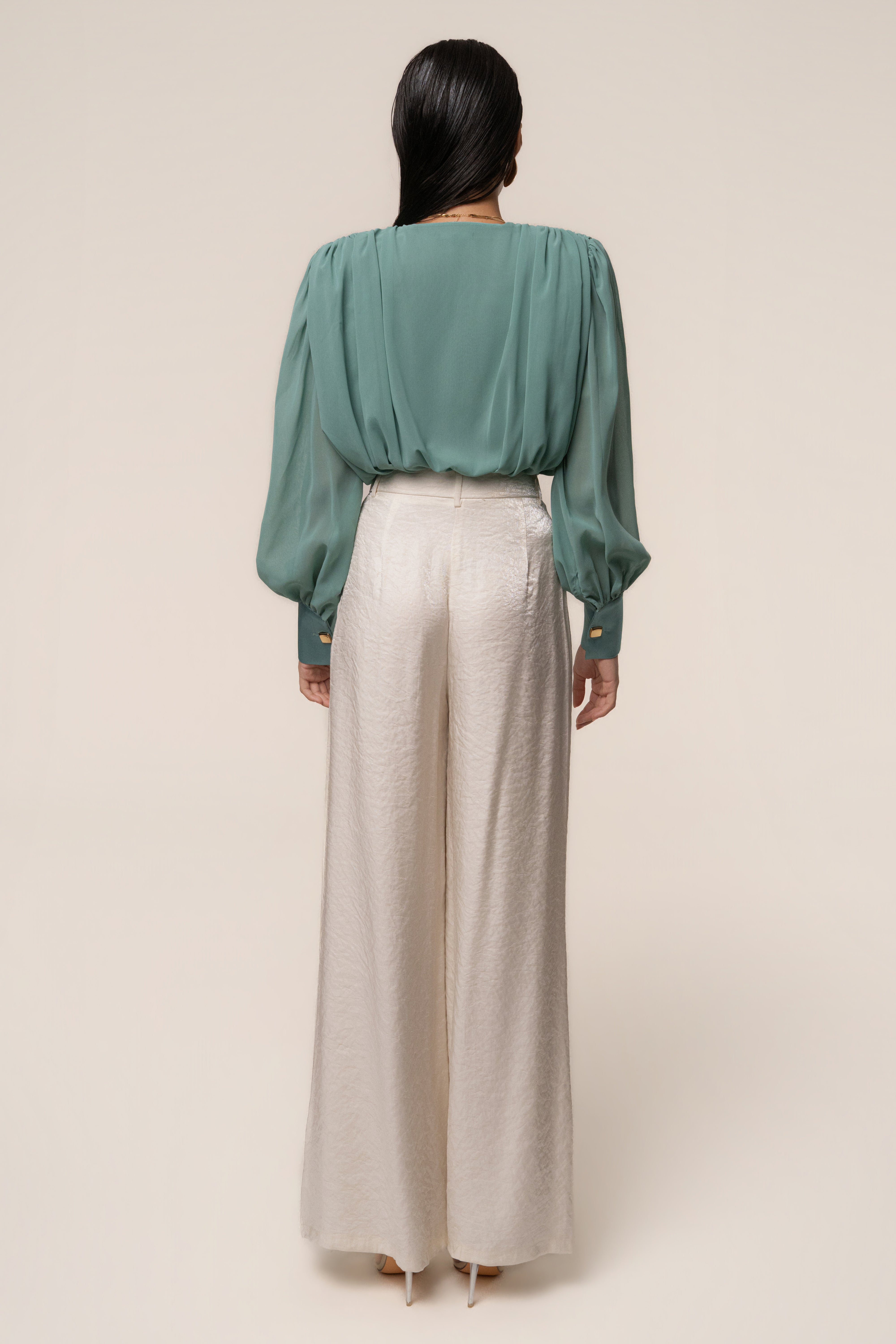 Teal JLUXLABEL pleated chiffon top with a relaxed fit, featuring light, flowing fabric and subtle pleats.