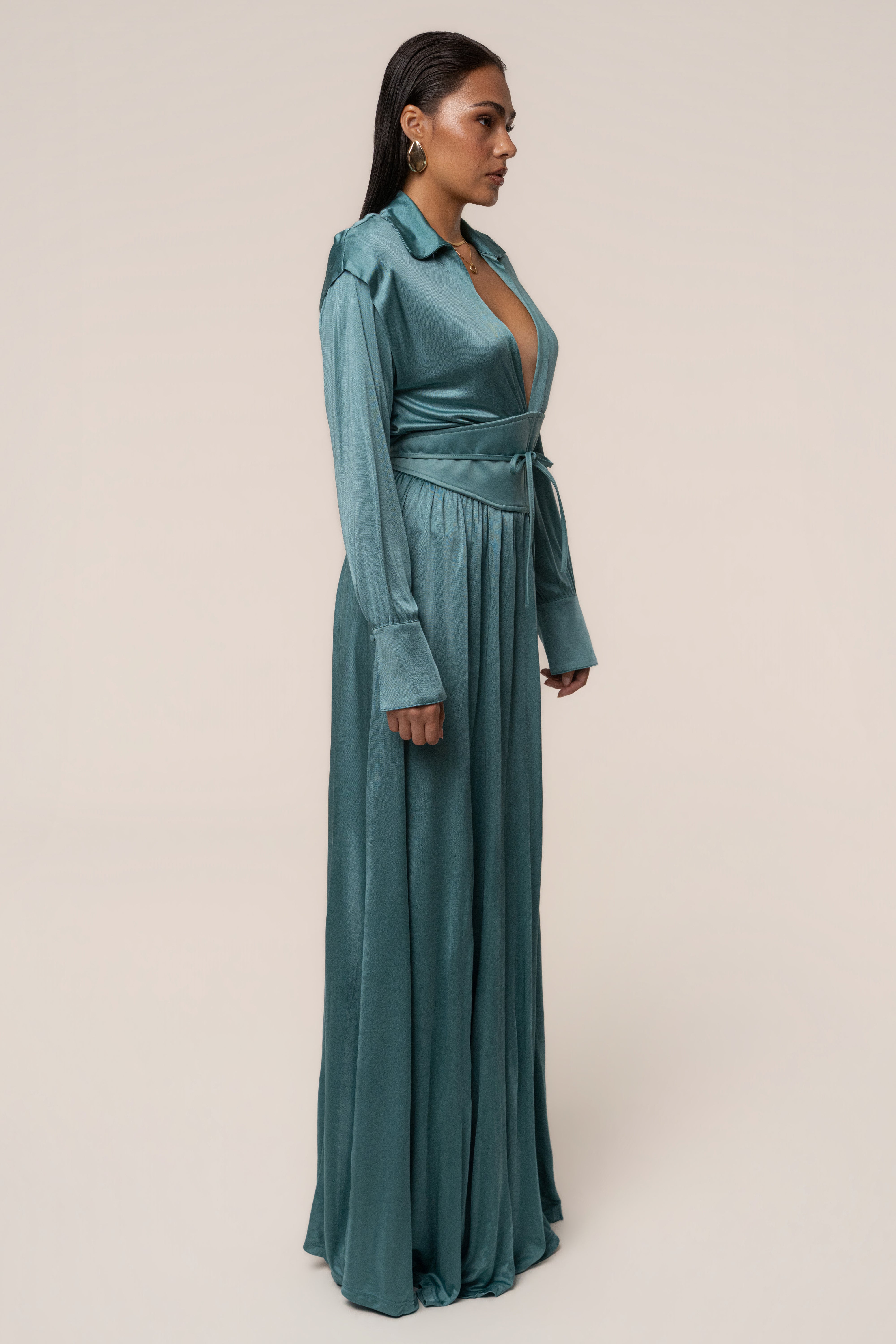 Teal high line collar maxi dress by JLUXLABEL, featuring a flowing fabric and elegant design, displayed on a mannequin.