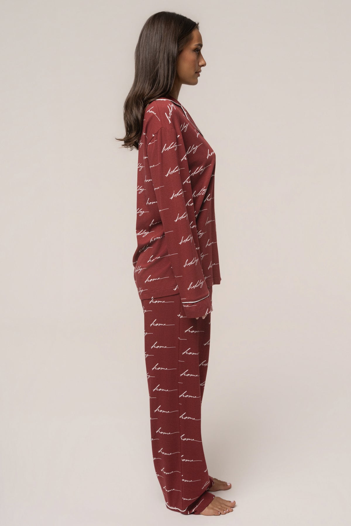 Burgundy JLUXLABEL adult pajama set with holiday-themed design, soft fabric, long-sleeve top, and matching pants for home wear.