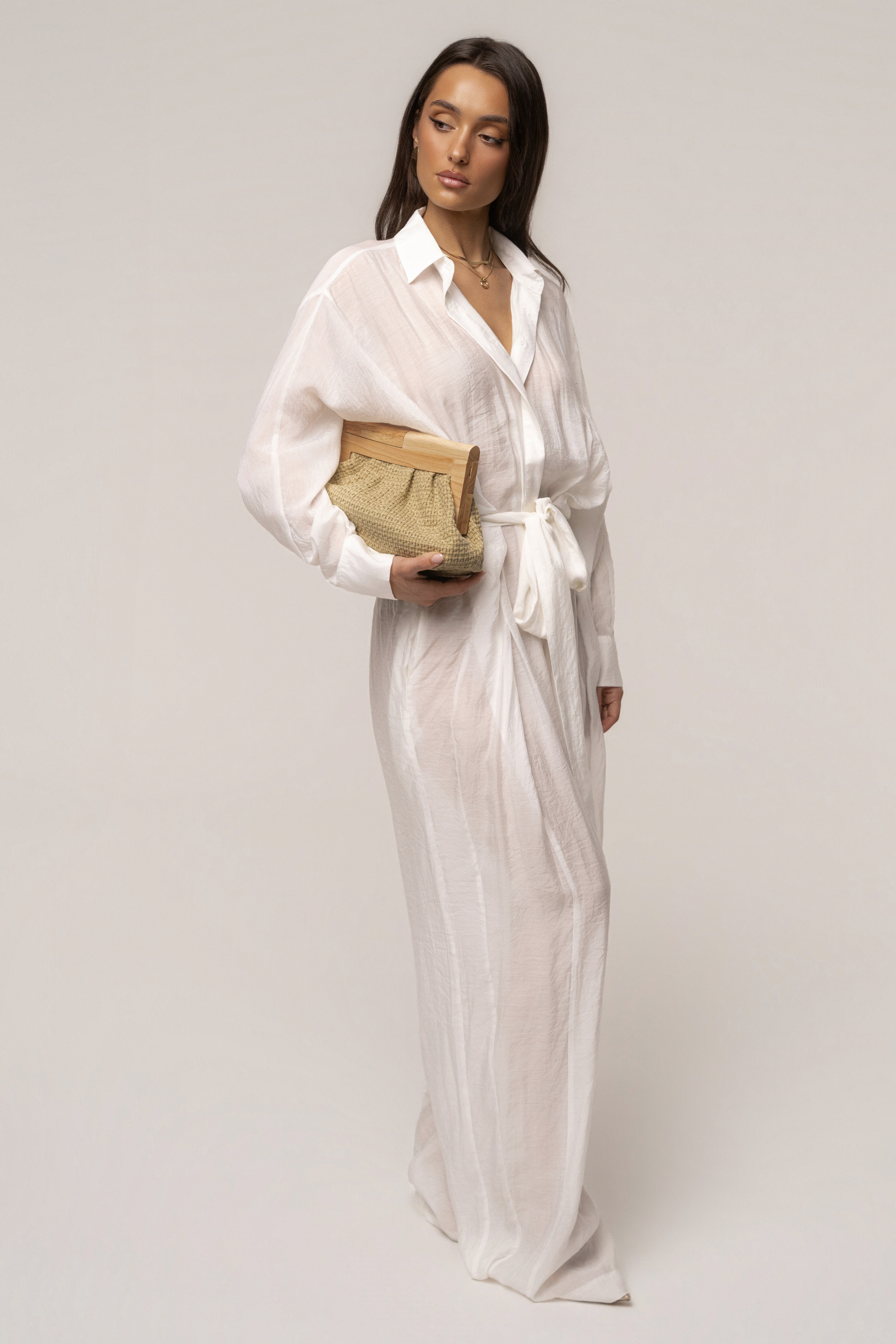 Natural Mykonos clutch bag by JLUXLABEL, showcasing woven straw design and elegant accessories for summer style.