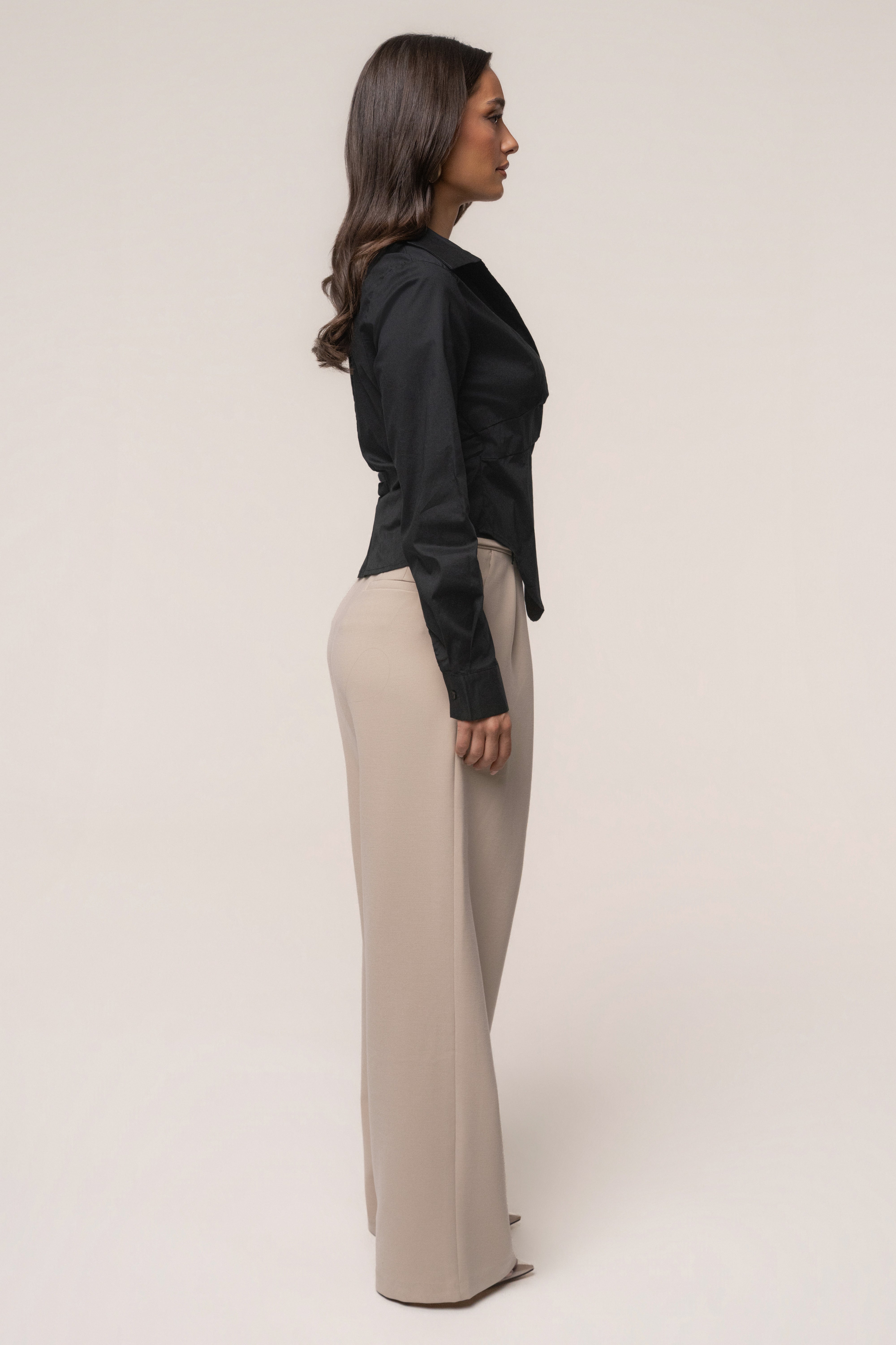 Black Sculpt and Form blouse by JLUXLABEL, showcasing a stylish fitted top with a sleek silhouette and modern design.