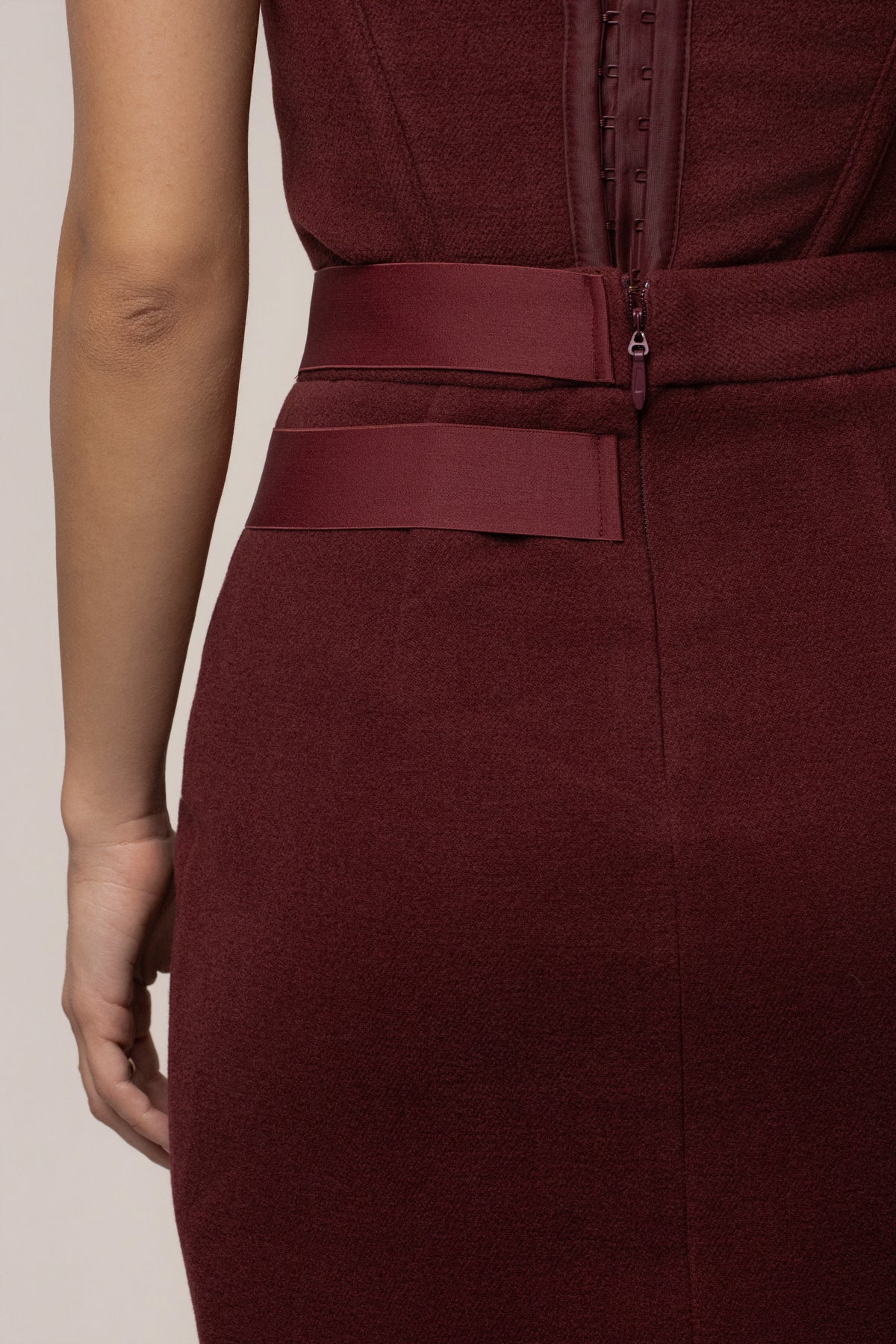 Burgundy Gisele slit skirt from JLUXLABEL, stylish bottoms with a thigh-high slit, made from flowy fabric, perfect for elegant outfits.