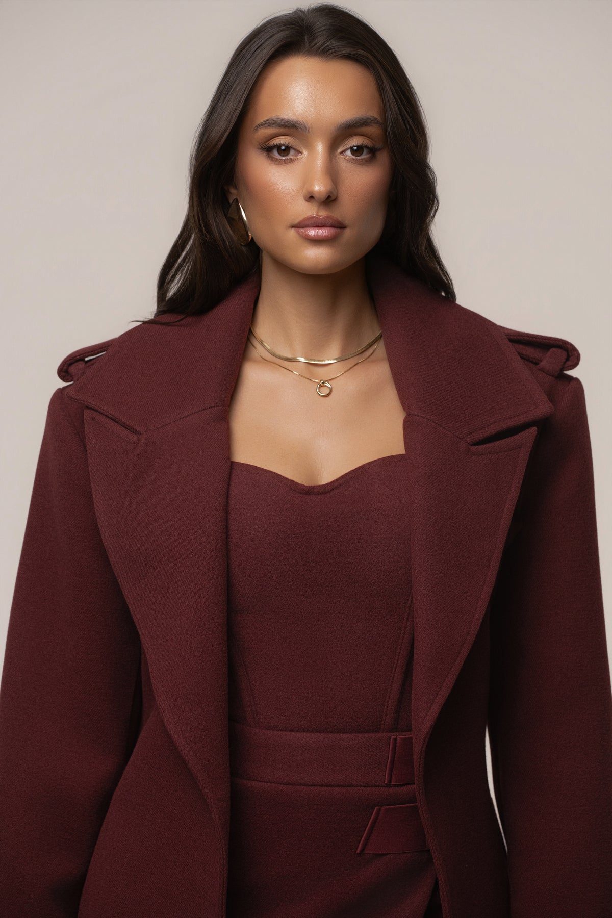 Burgundy Savannah belted coat by JLUXLABEL, stylish outerwear with a tailored fit and belt detail, perfect for fall or winter wear.