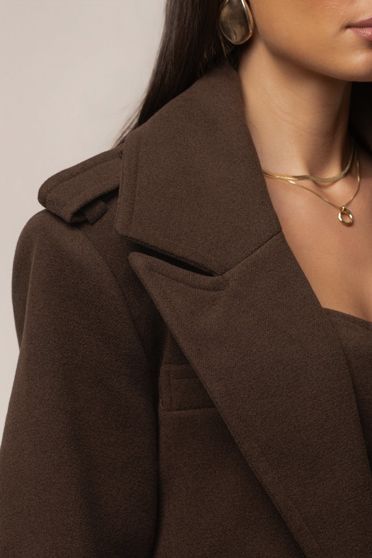 JLUXLABEL chocolate Savannah belt coat, stylish outerwear with a belted design, shown on a model.