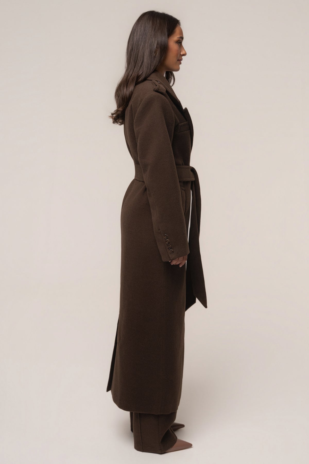 Chocolate Savannah belted coat by JLUXLABEL, stylish outerwear with a tailored fit and belt at the waist, displayed on a model.
