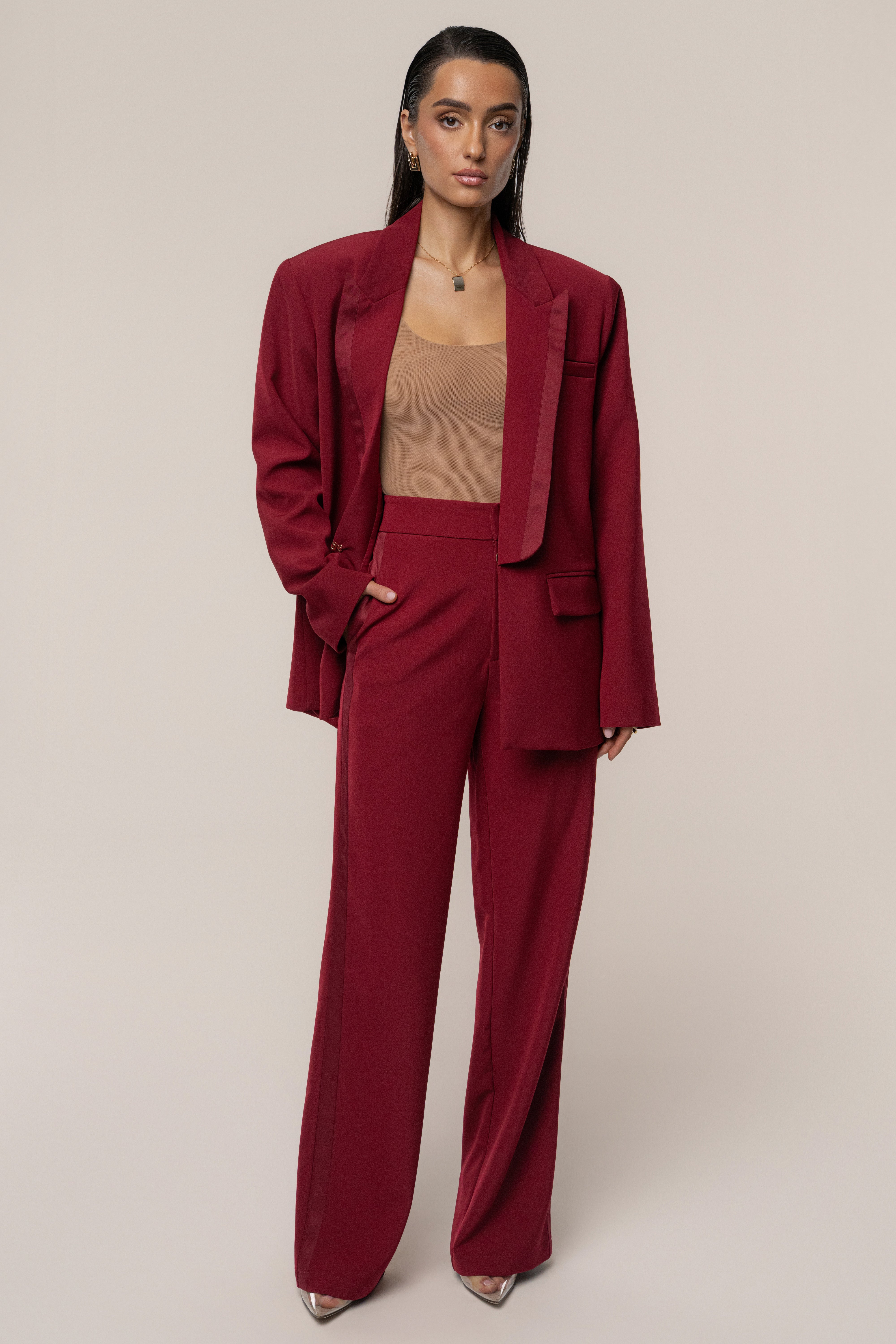 Burgundy JLUXLABEL Suite Life woven pants shown on a model, stylish bottoms with a tailored fit and woven fabric.