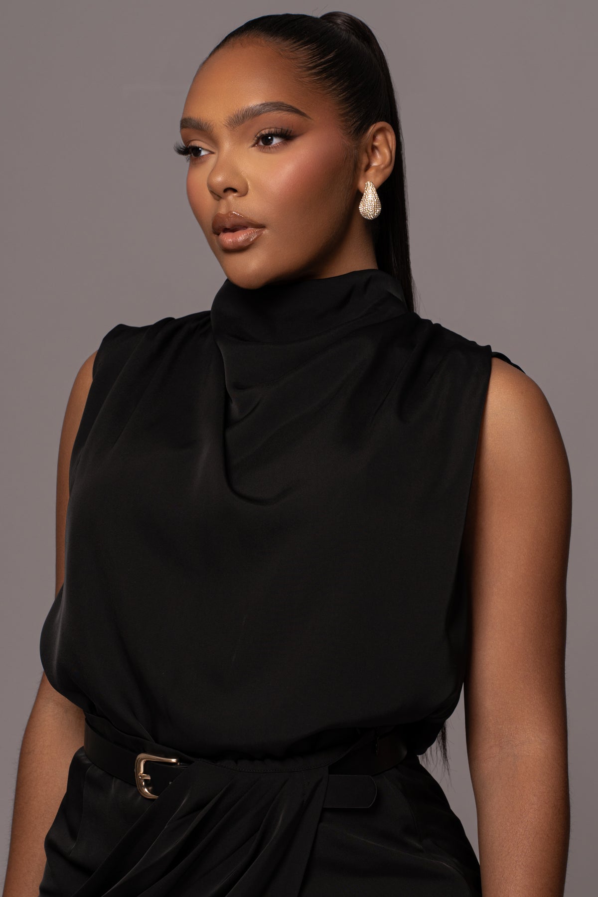 Black Desiree mock neck top from JLUXLABEL, featuring a fitted design and long sleeves, shown on a neutral background.