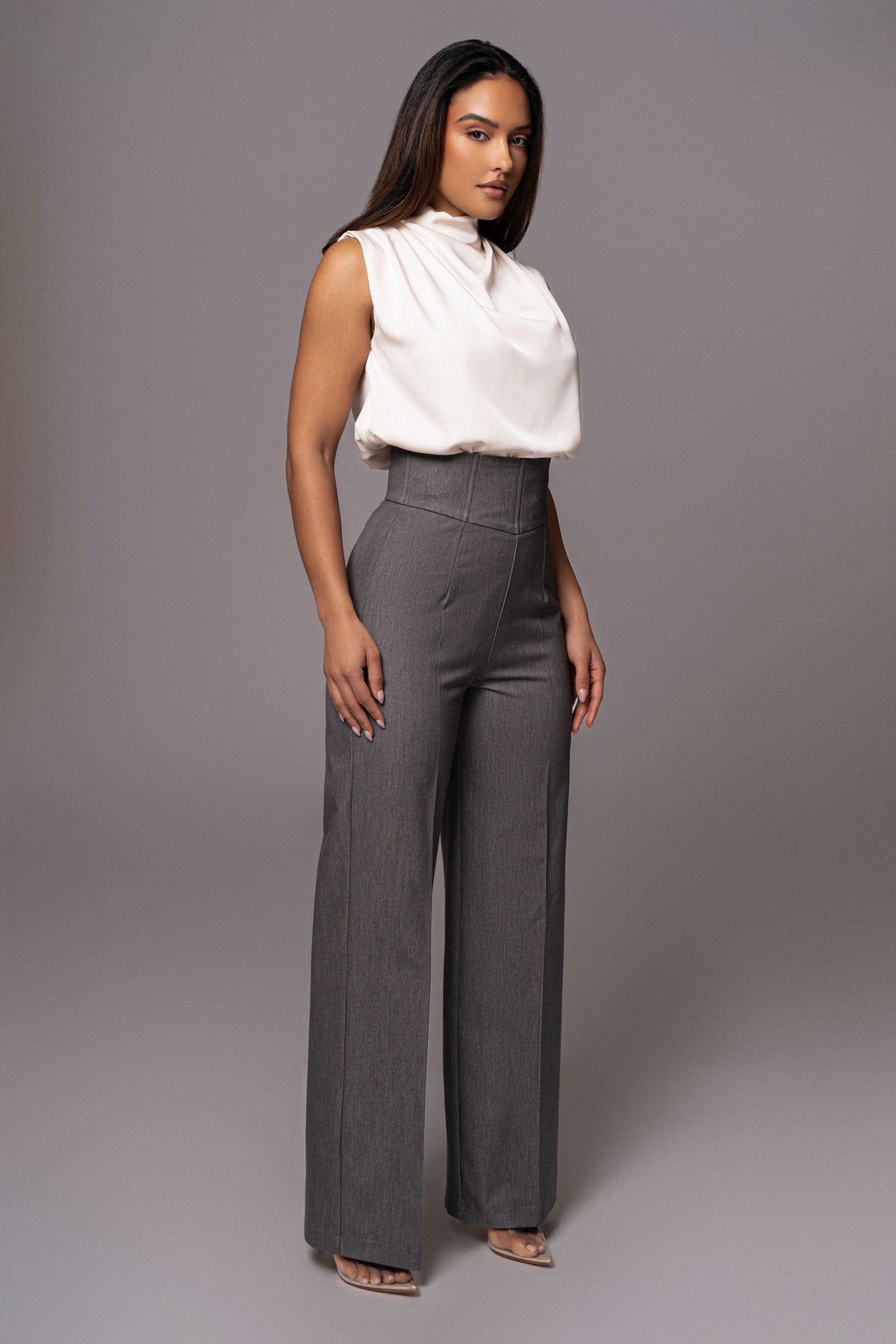 JLUXLABEL Buttercream Desiree mock neck top worn casually, featuring a fitted silhouette and soft fabric in a creamy buttercream color.