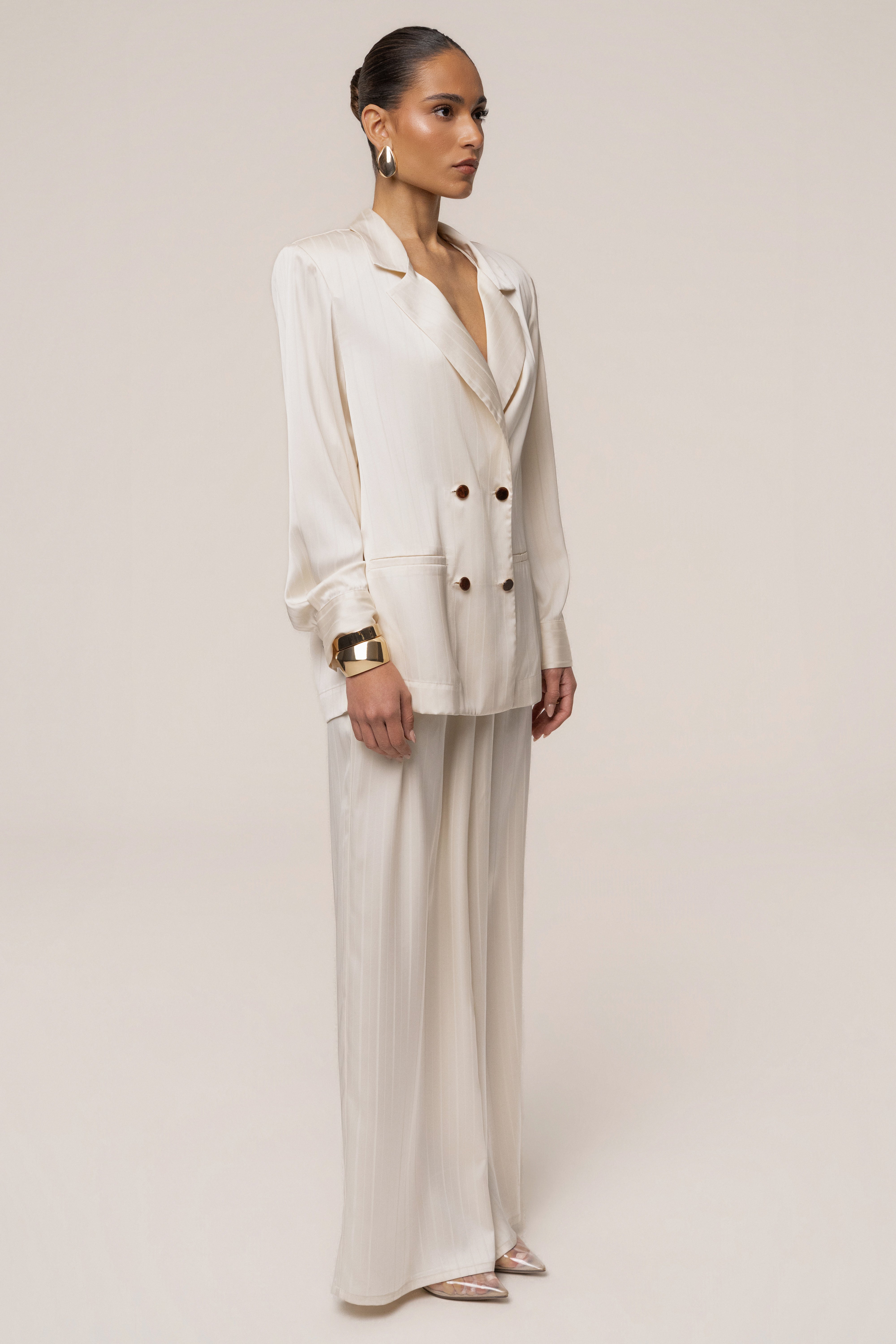 Ivory JLUXLABEL The Standard Blazer, stylish tailored top with classic lapel, front buttons, and long sleeves, on a plain background.
