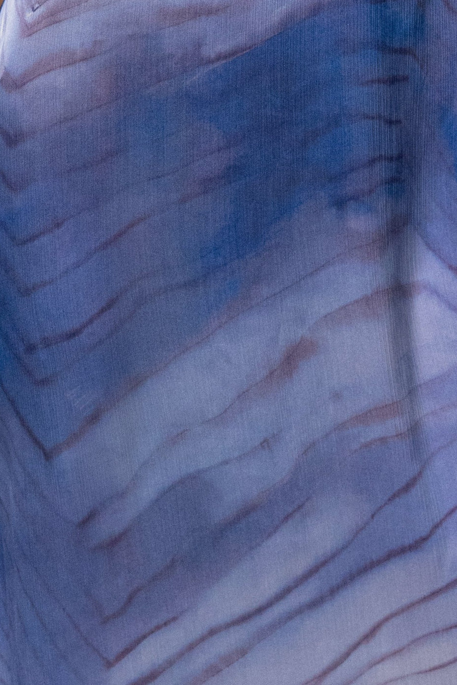 Blue Sunset Waves Maxi Dress from JLUXLABEL features flowing fabric with a vibrant wave pattern, perfect for elegant summer occasions.