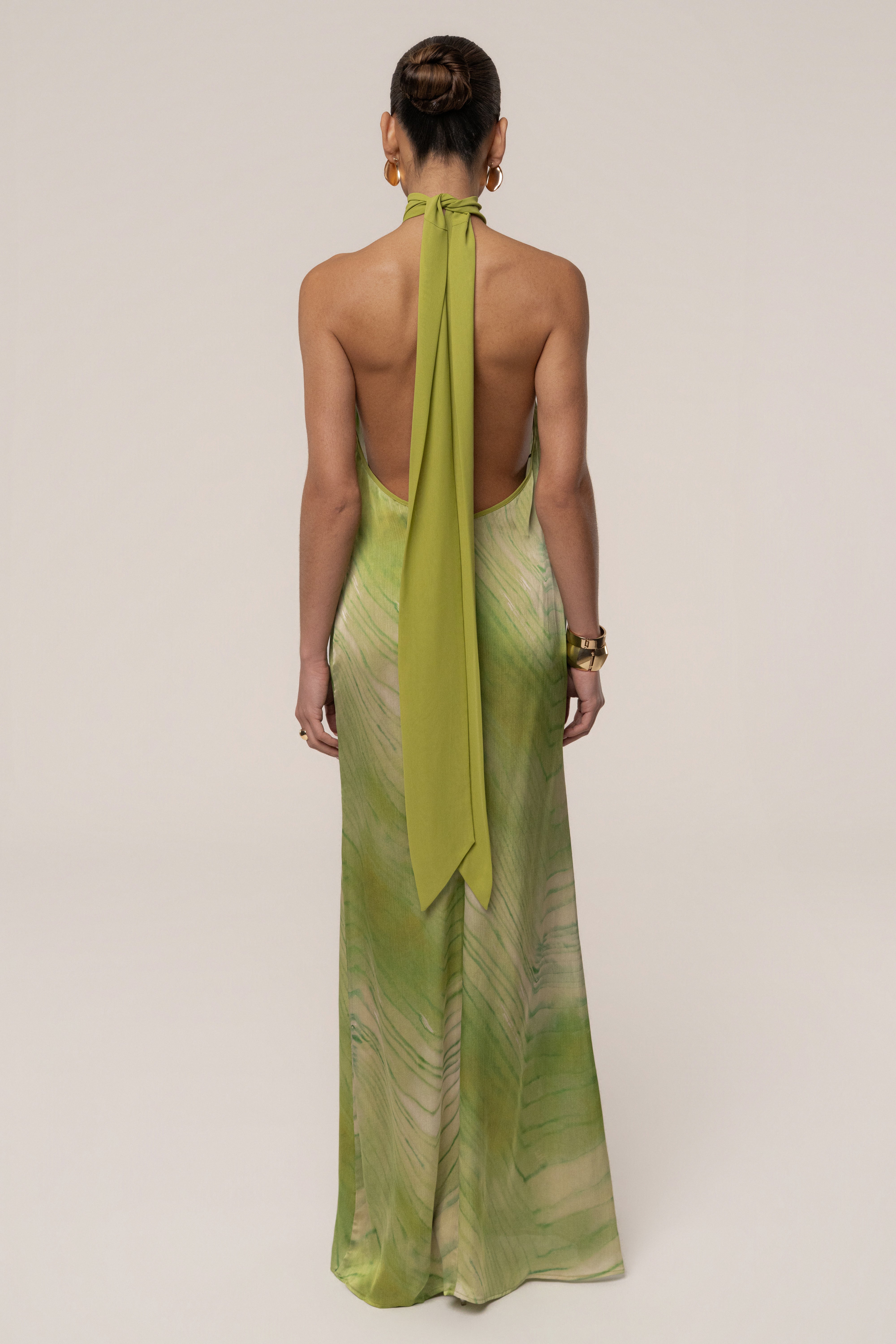 Green Sunset Waves maxi dress by JLUXLABEL featuring flowing fabric and vibrant wave pattern, perfect for summer or casual occasions.
