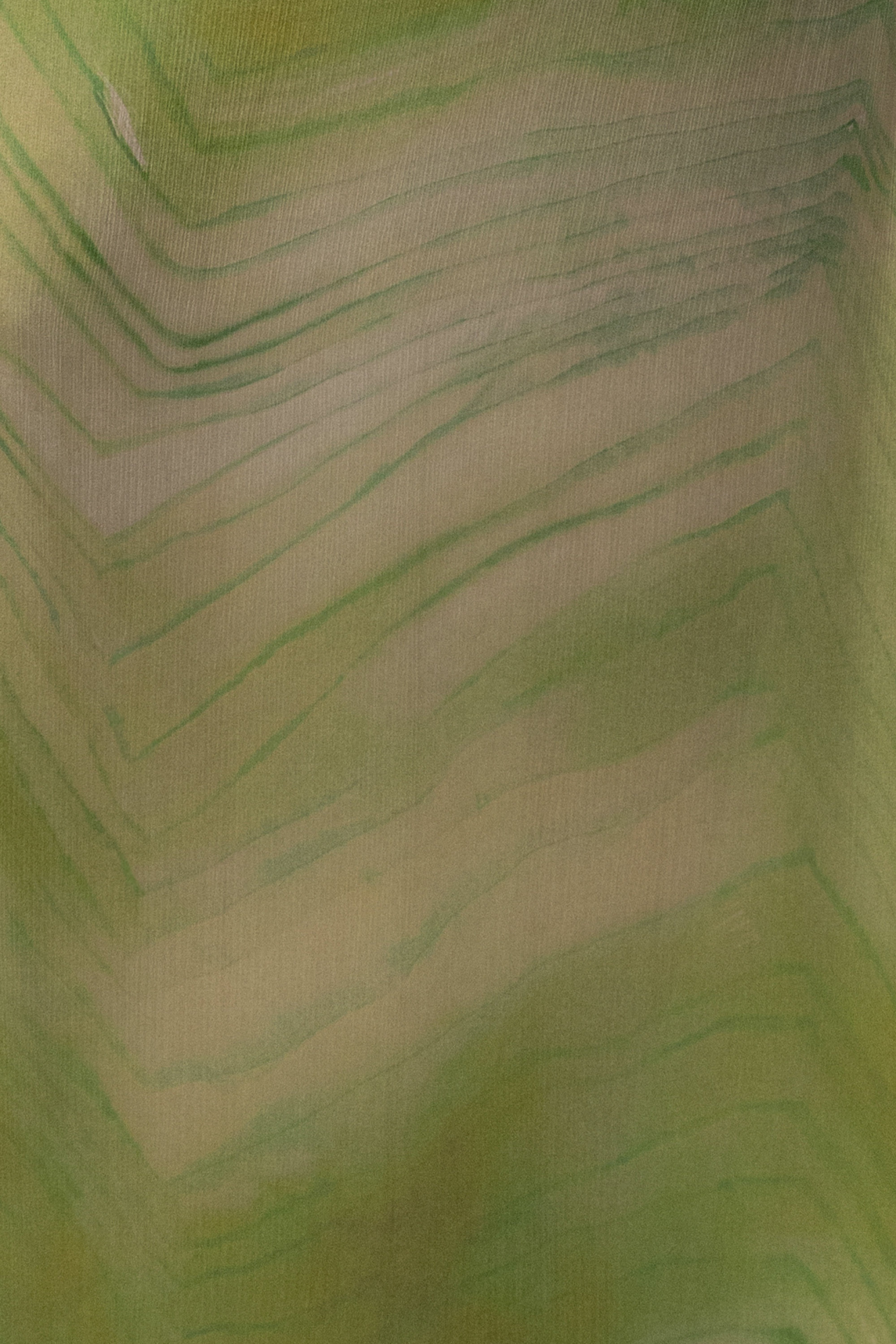Green Sunset Waves maxi dress by JLUXLABEL featuring a flowing fabric with a vibrant wave pattern and sleeveless design.