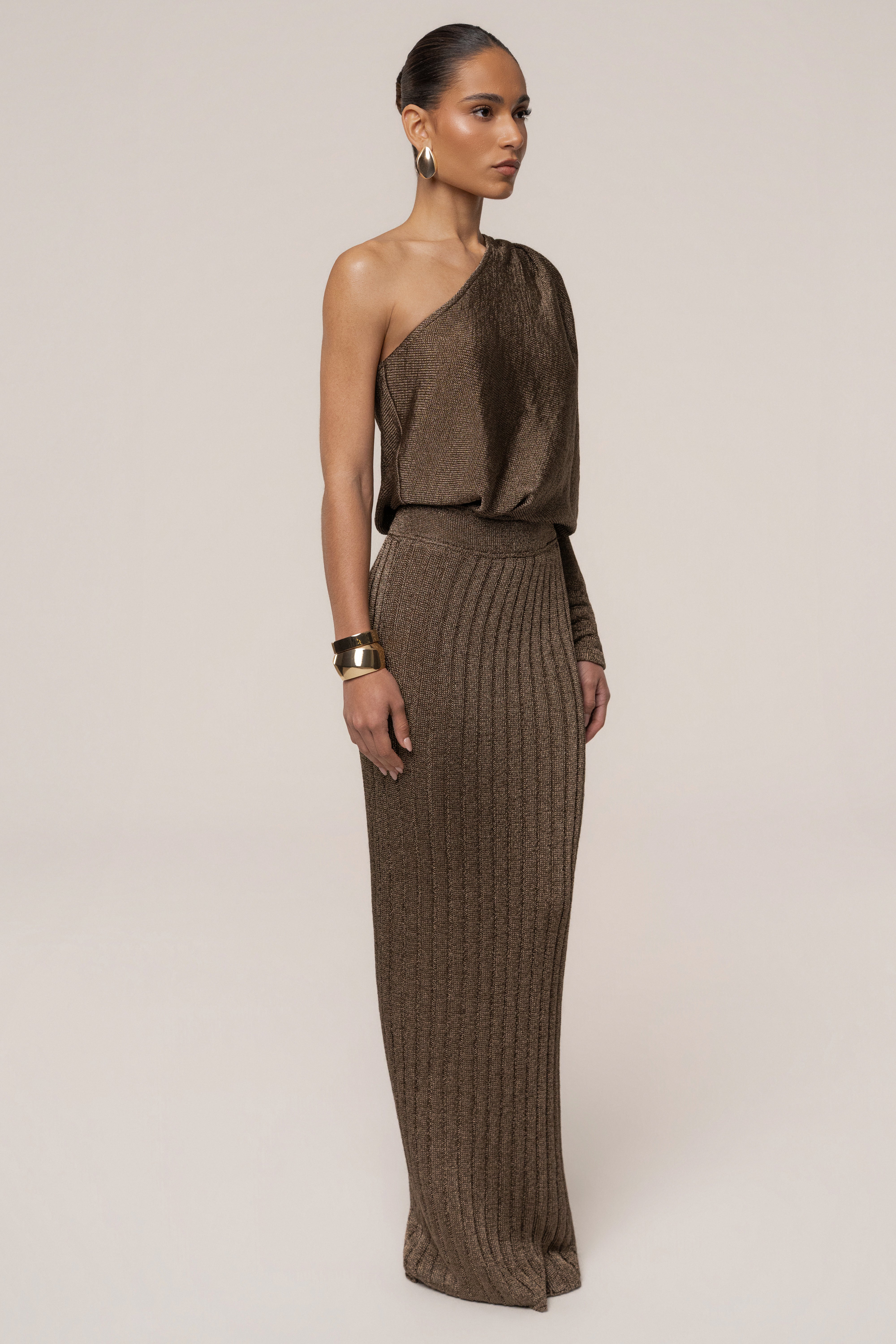 Bronze metallic maxi skirt from JLUXLABEL featuring a flowing design and elegant resort style, perfect for summer or vacation wear.