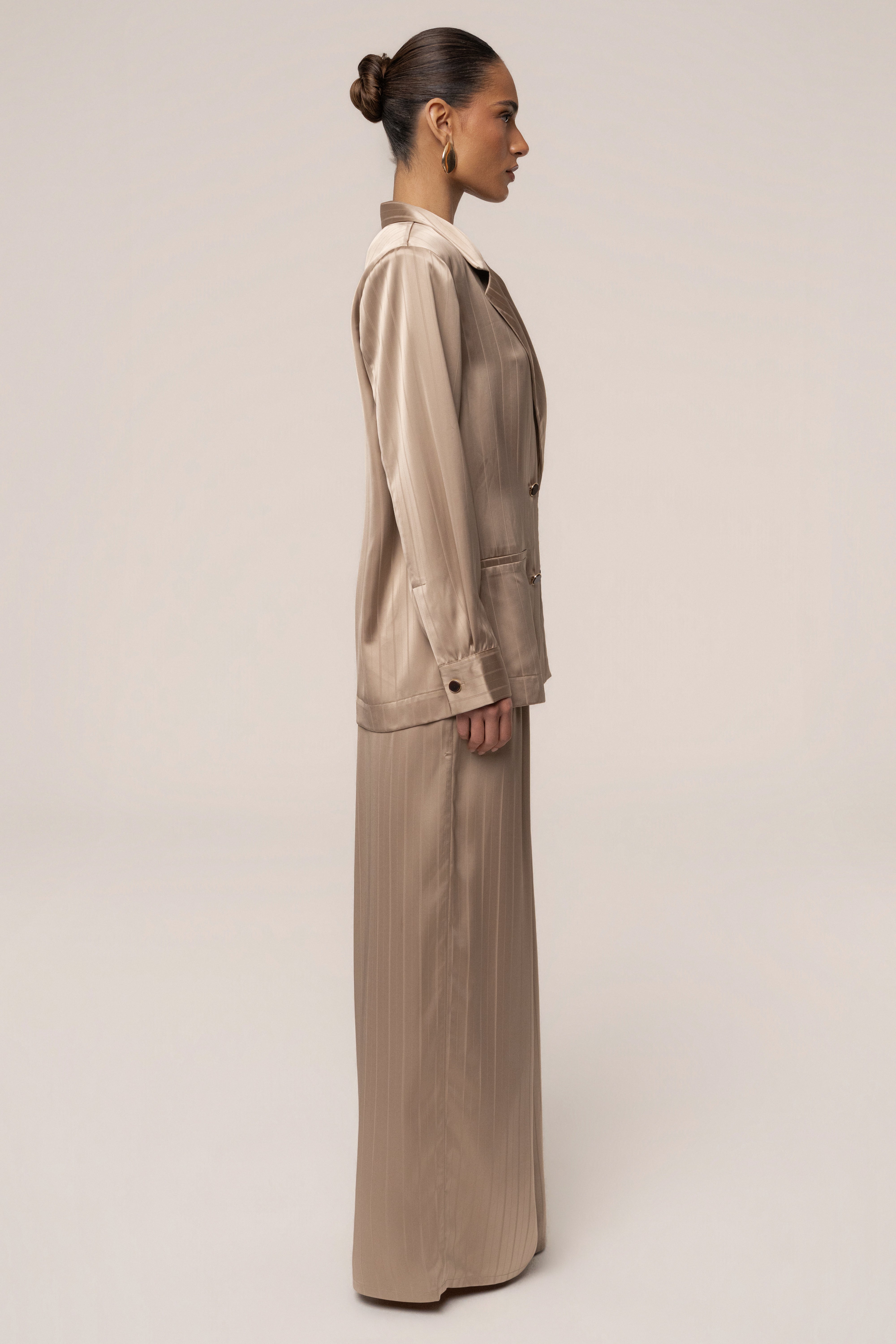 JLUXLABEL Stone The Standard blazer, a stylish tailored top in neutral stone color, shown on a model with front view.