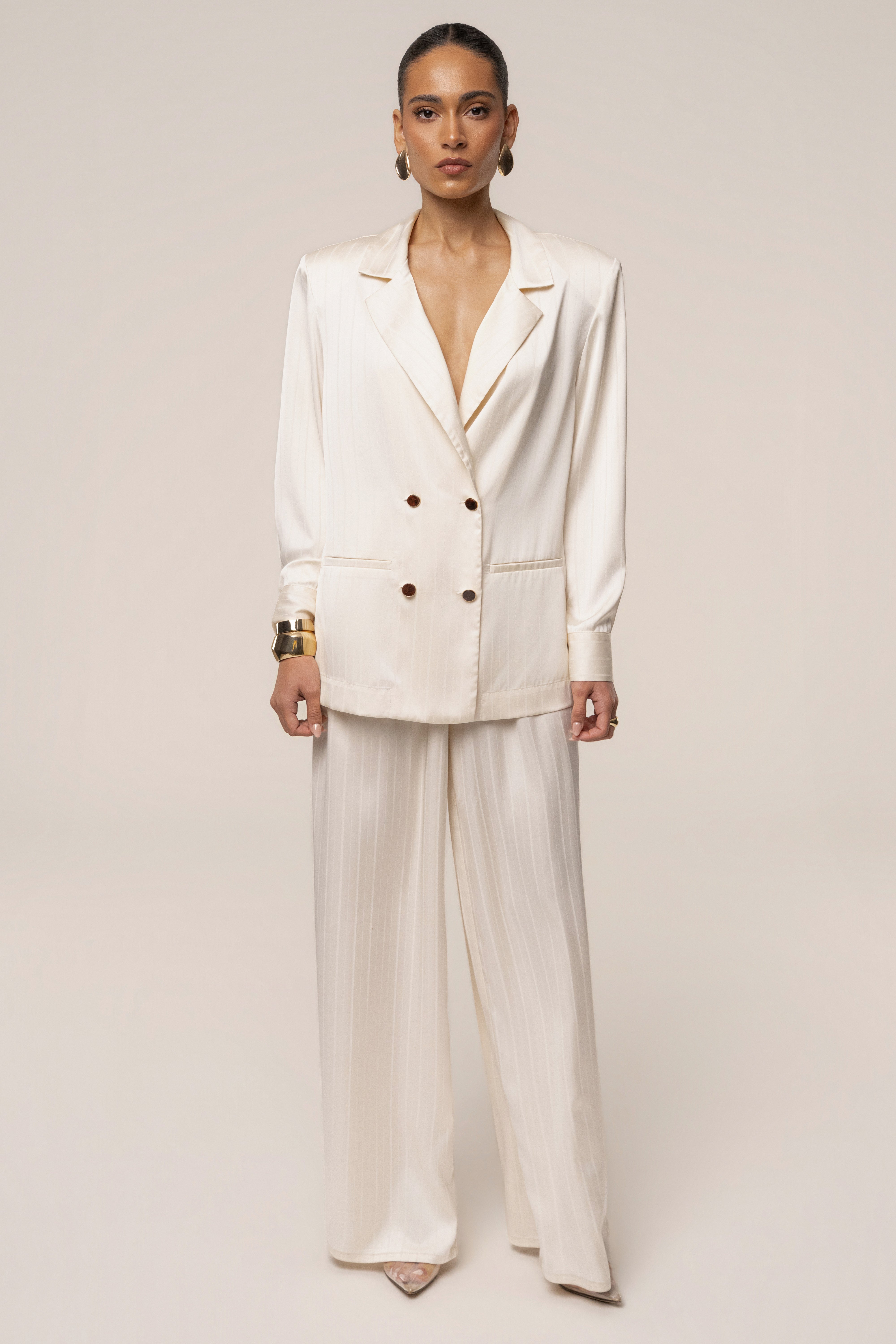 Ivory JLUXLABEL The Standard Pant bottoms with a relaxed fit and tailored design, displayed on a neutral background.
