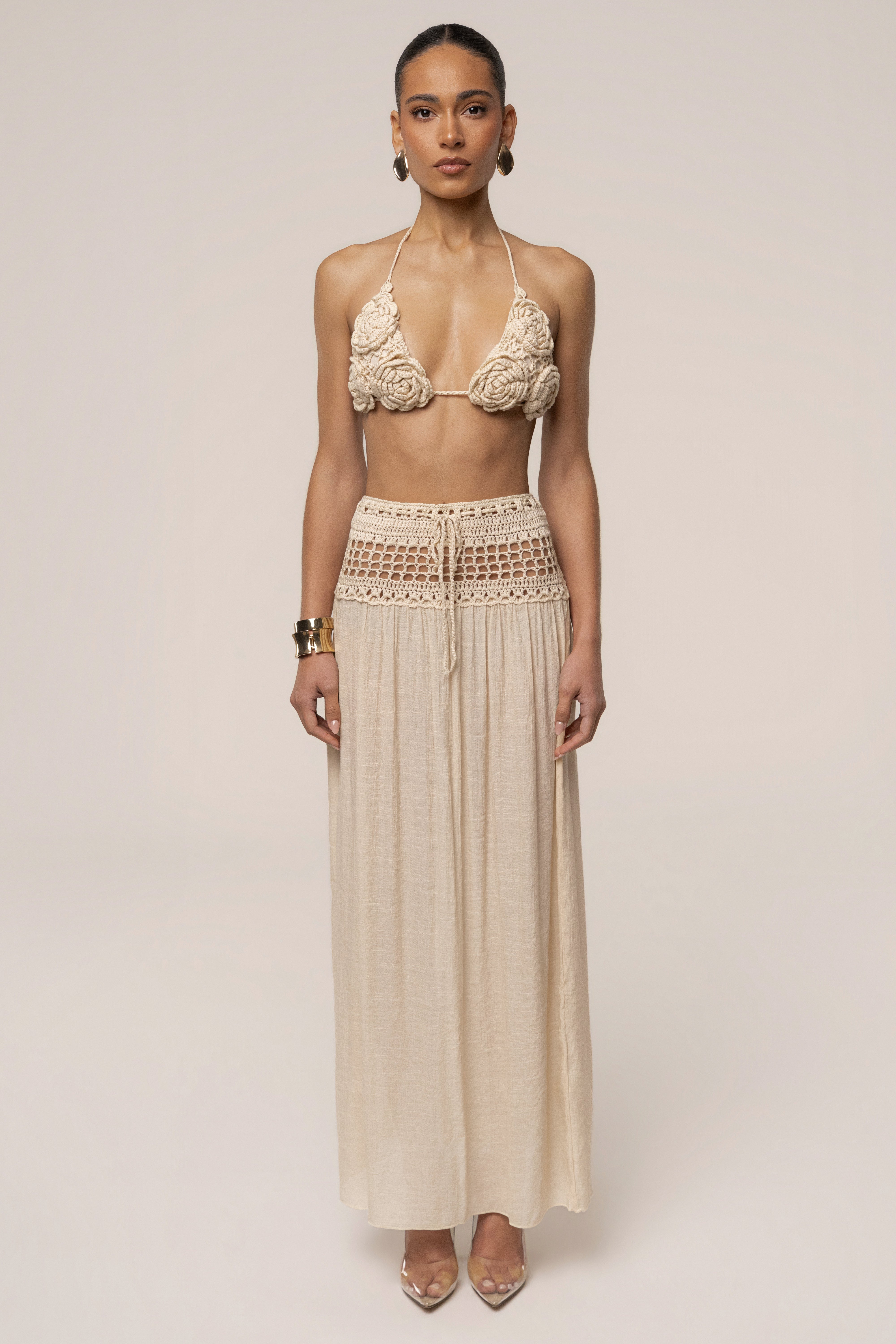 Beige crochet maxi skirt from JLUXLABEL featuring a flowing resort-style design, perfect for summer beachwear and casual outings.