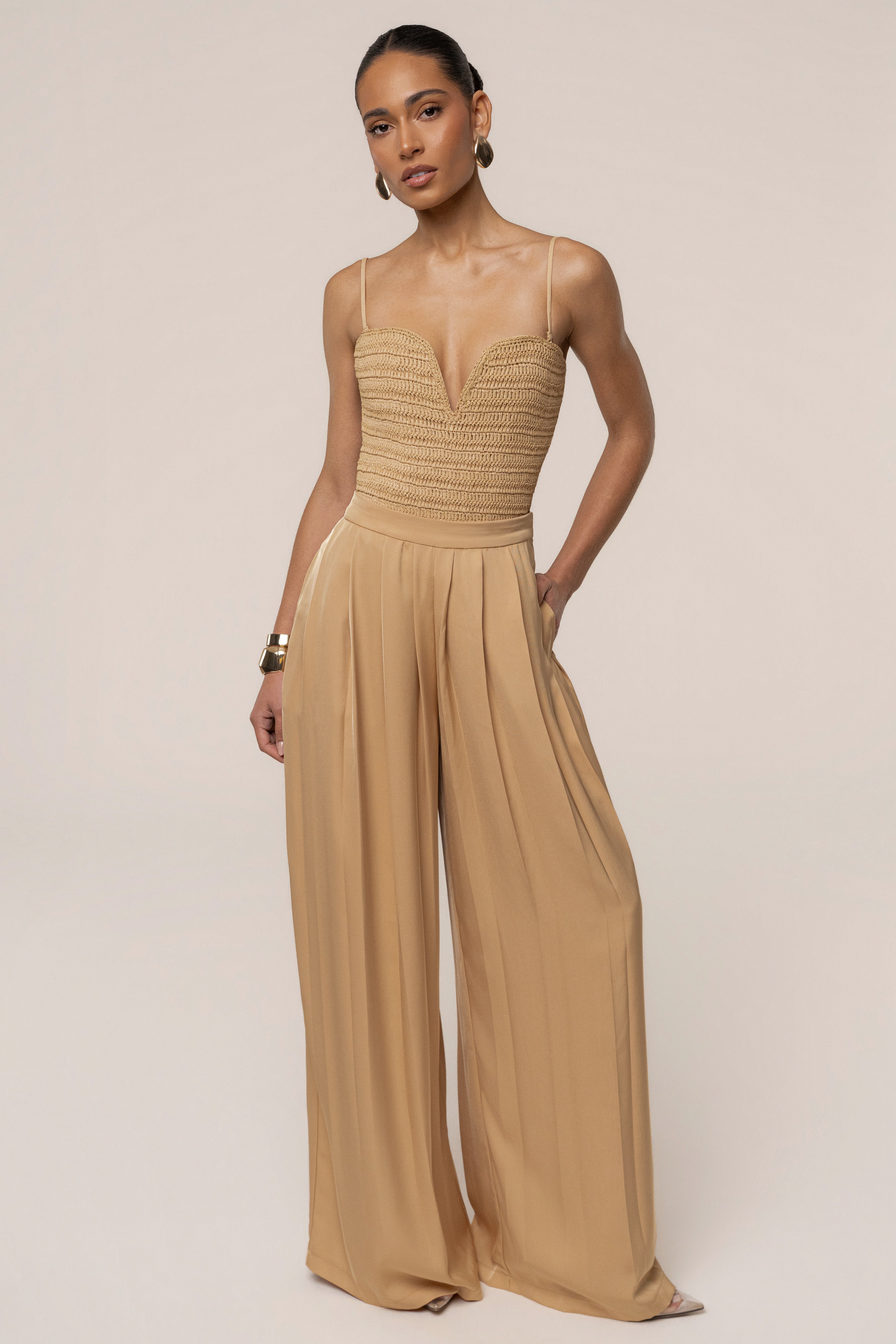 Beige JLUXLABEL Clara wide-leg pleated trousers, stylish bottoms with a flowy fit and pleated design, perfect for casual or formal wear.