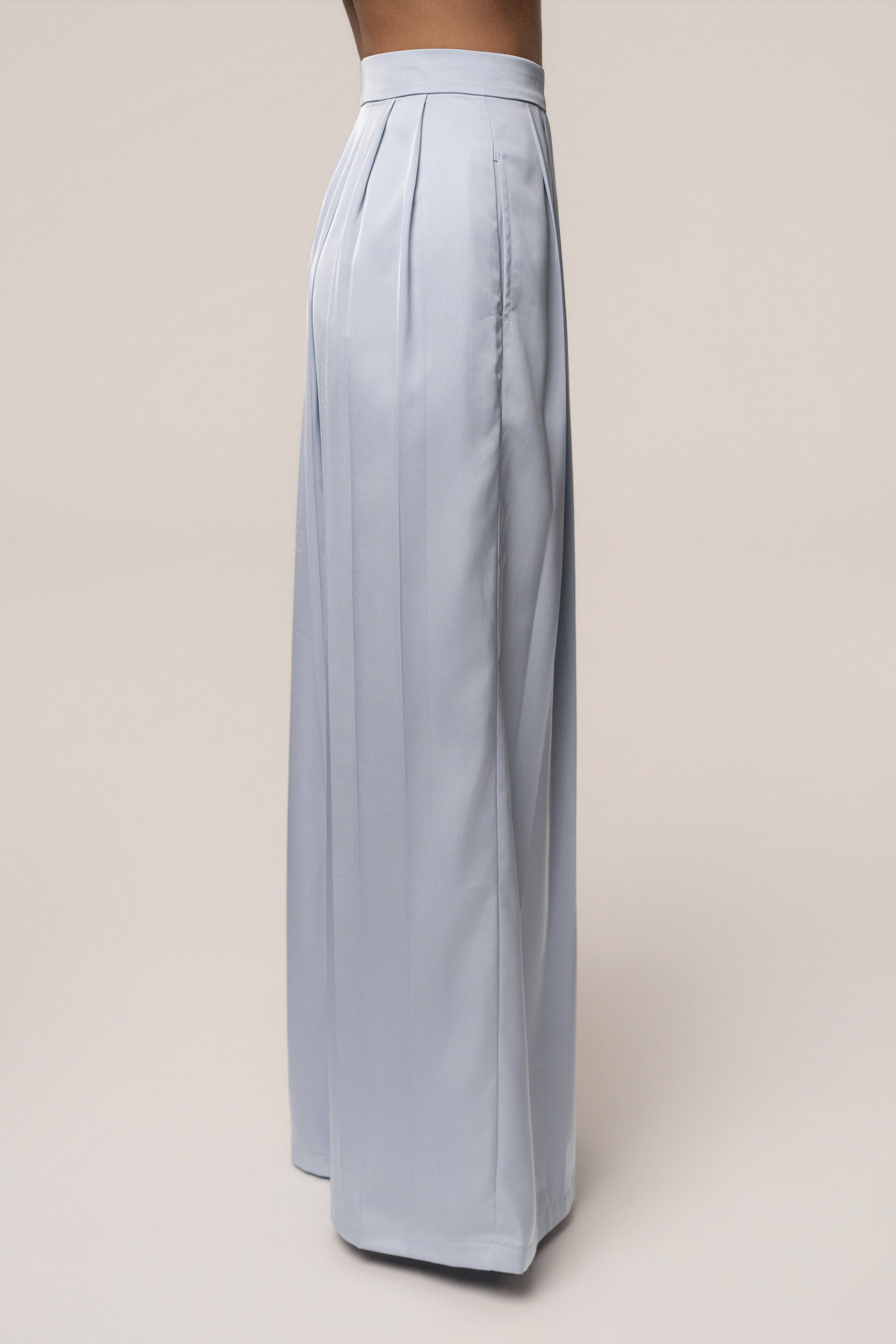 Blue Clara wide-leg pleated trousers from JLUXLABEL, featuring a relaxed fit and stylish pleats, perfect for casual or office wear.