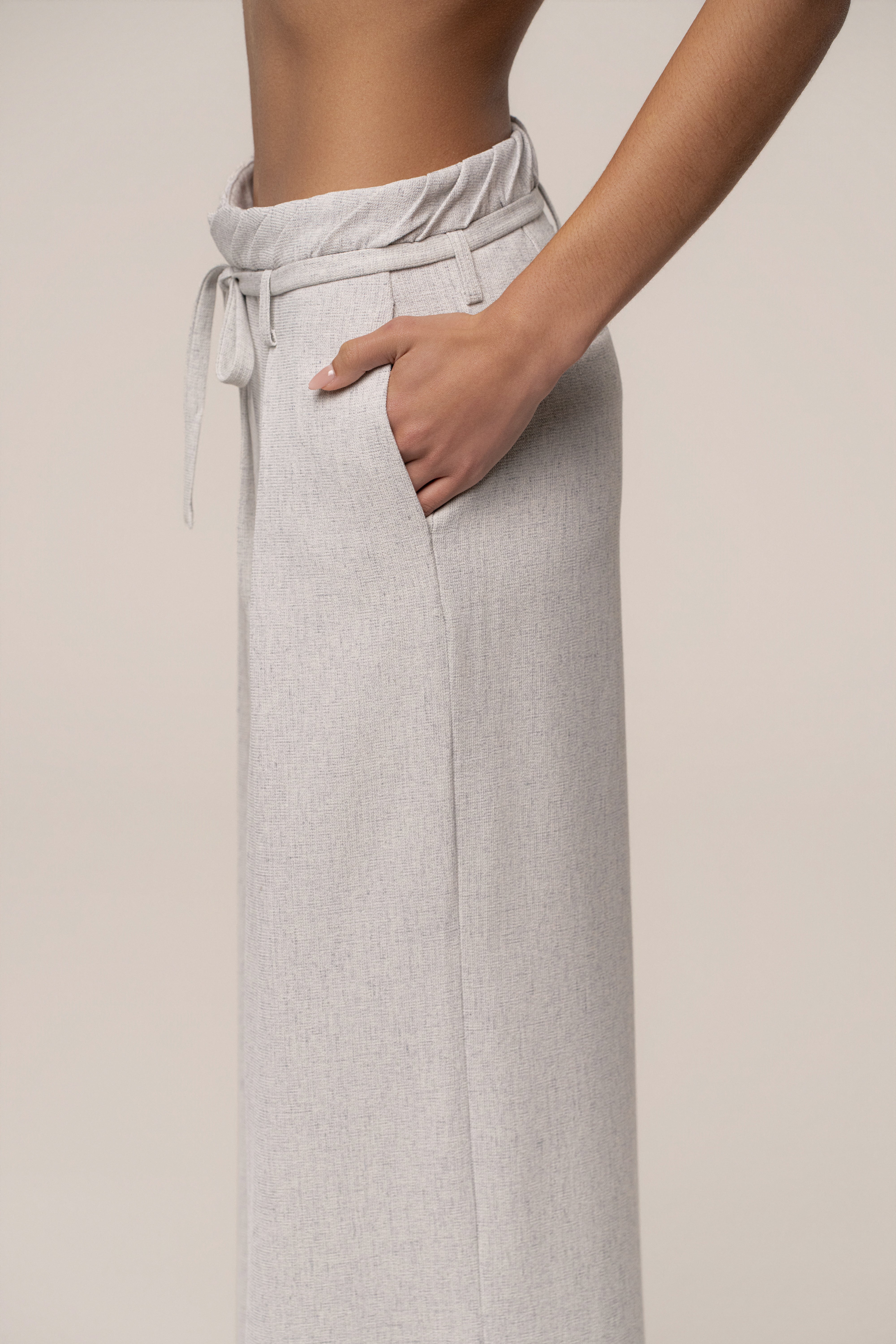 Heather grey JLUXLABEL wide leg pants, refined ease bottoms with a relaxed fit, shown on a model in a casual setting.