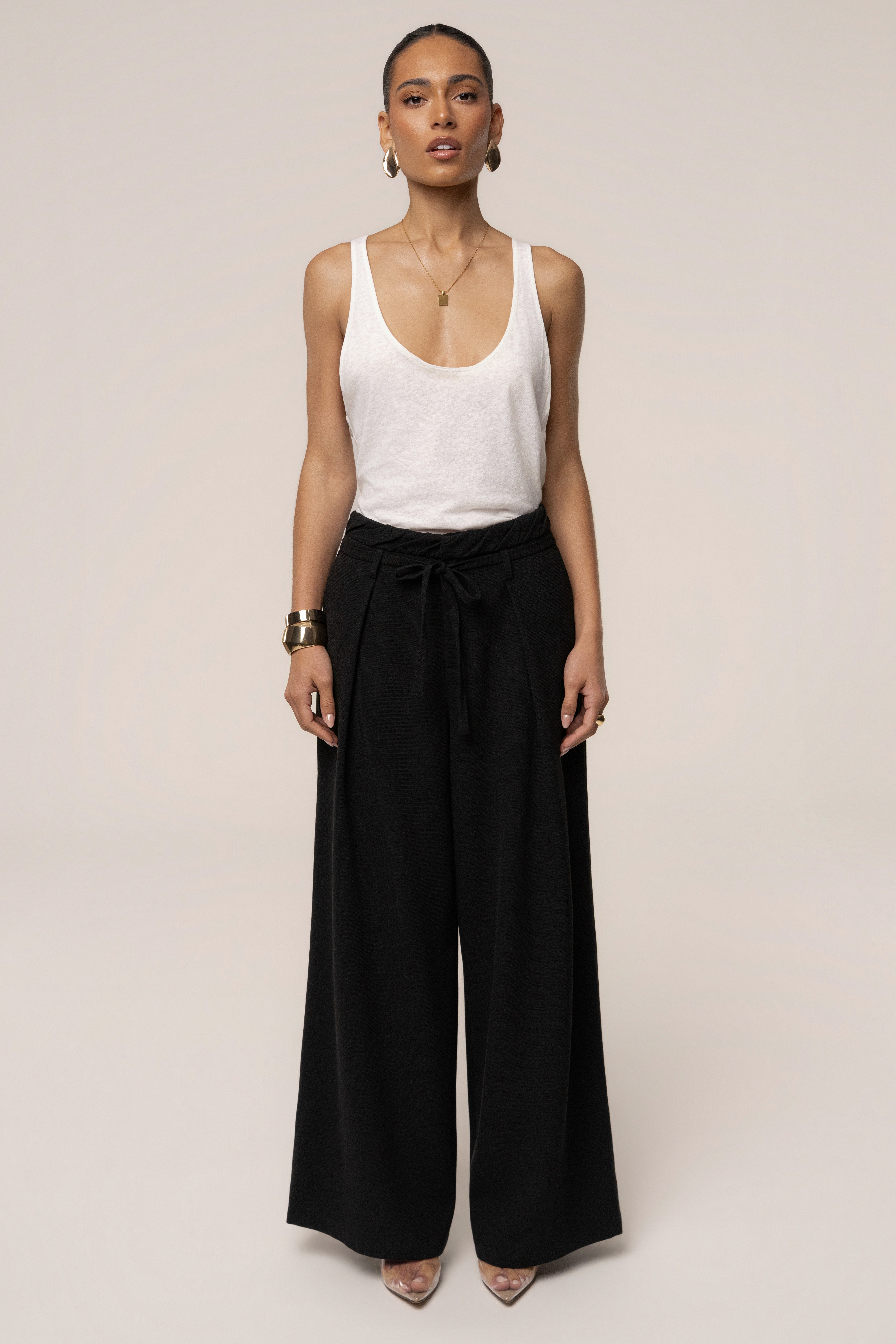 Black JLUXLABEL refined ease wide-leg pants, stylish bottoms with a relaxed fit and wide silhouette, shown on a model.