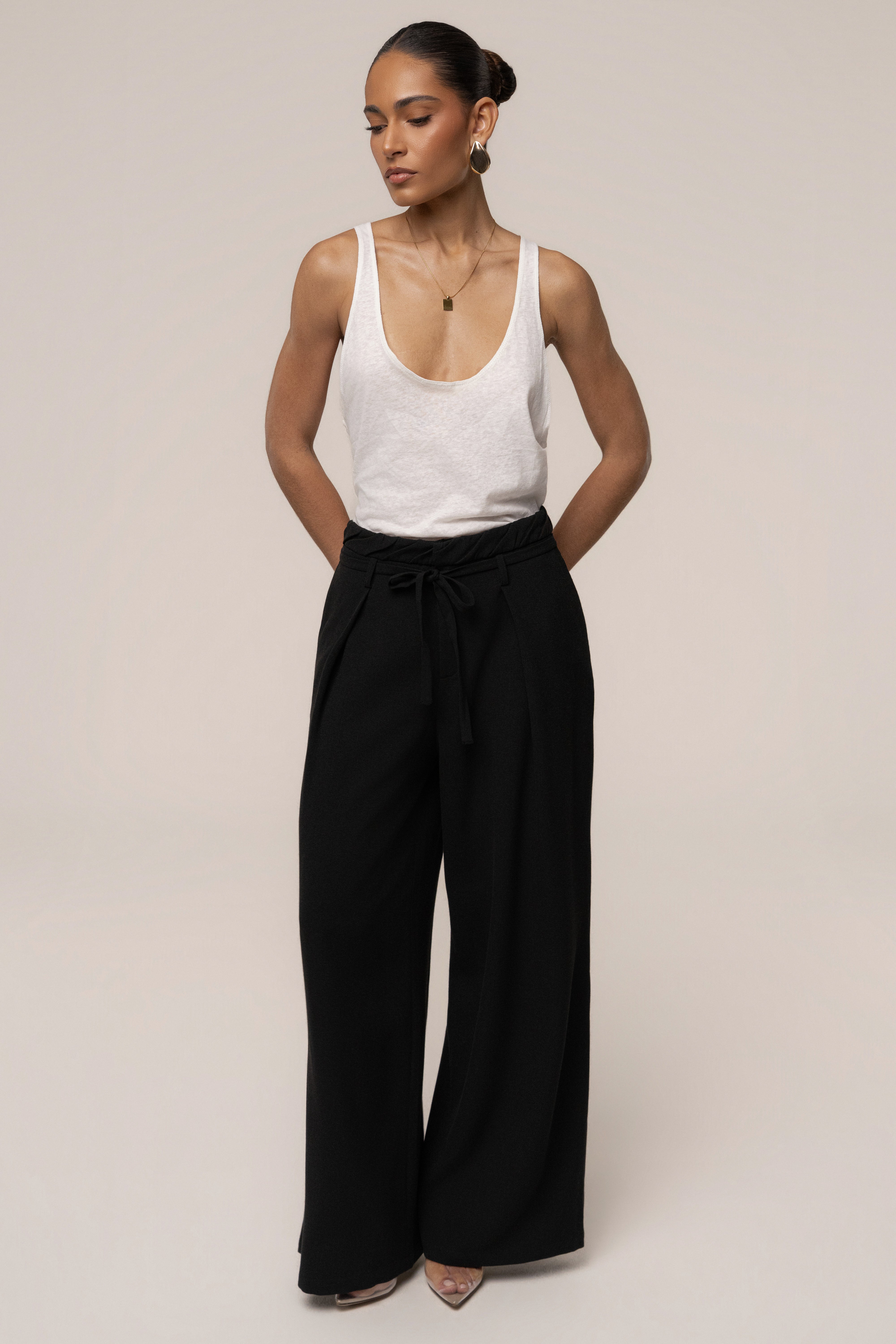 Black JLUXLABEL refined wide-leg pants with a relaxed fit, featuring a high waist and flowing fabric for a stylish, comfortable look.