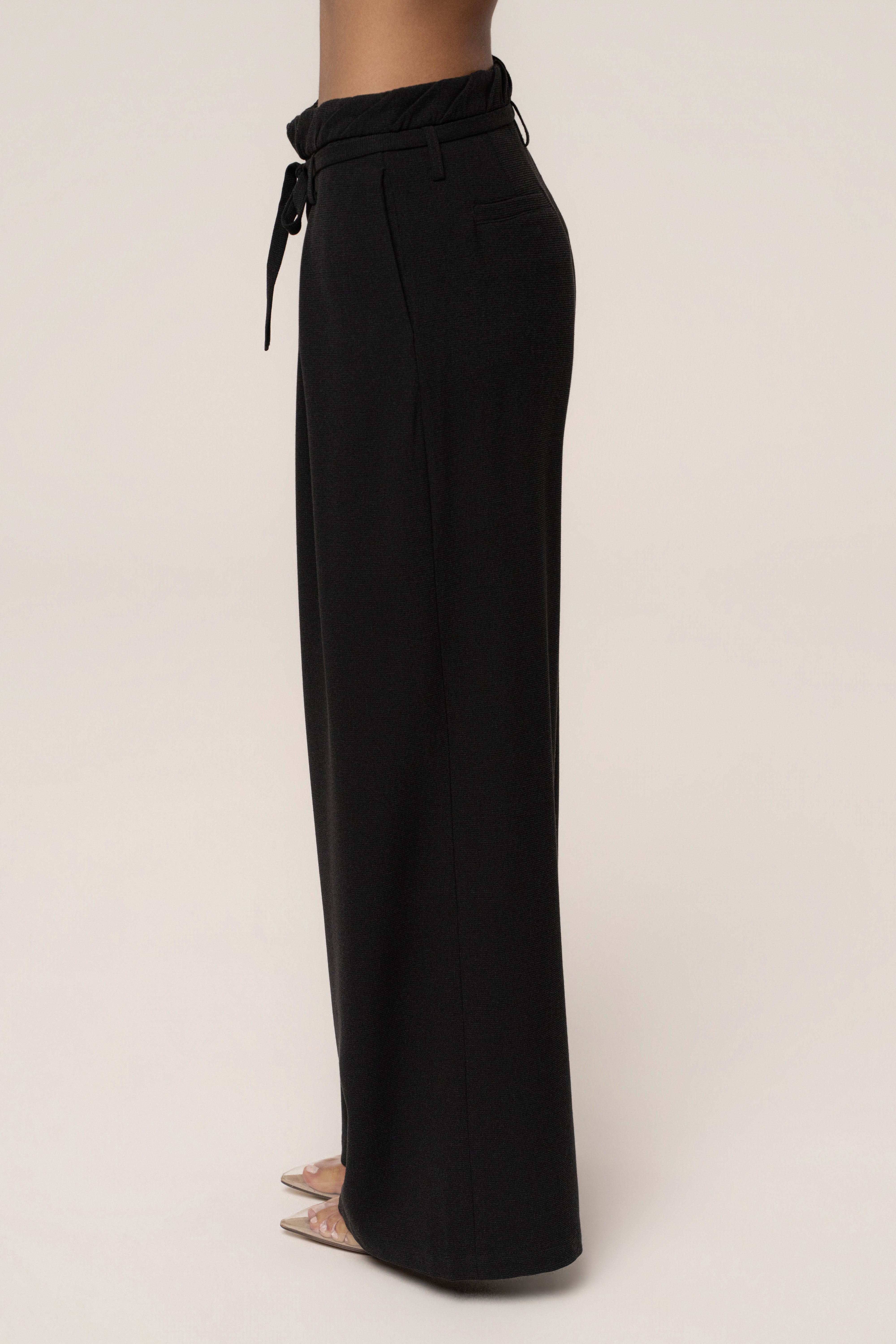 Black JLUXLABEL refined ease wide-leg pants, stylish bottoms with a relaxed fit and wide silhouette, shown on a model.