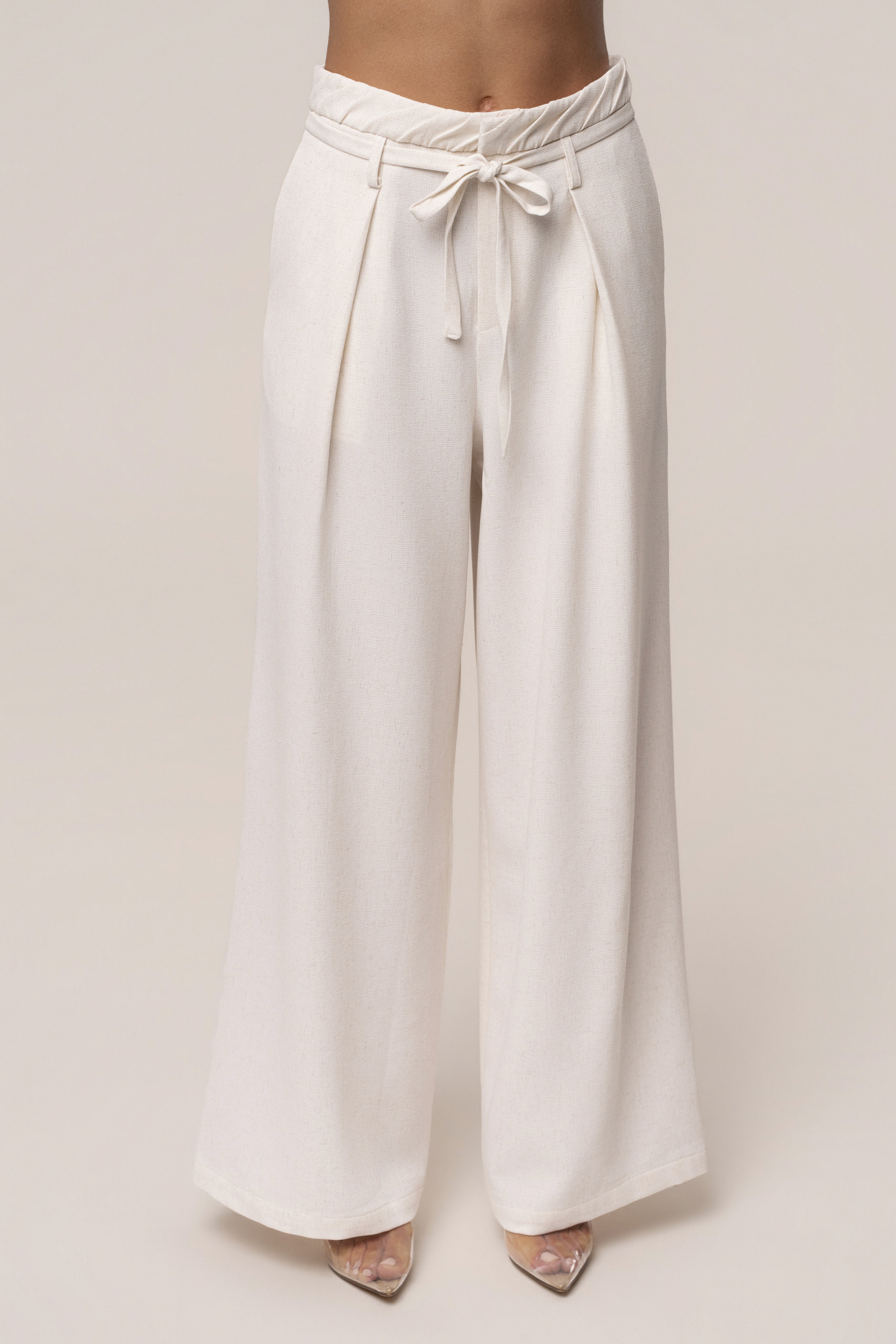 Ivory JLUXLABEL Refined Ease wide-leg pants, stylish bottoms with a relaxed fit and flowing design, shown from the front.