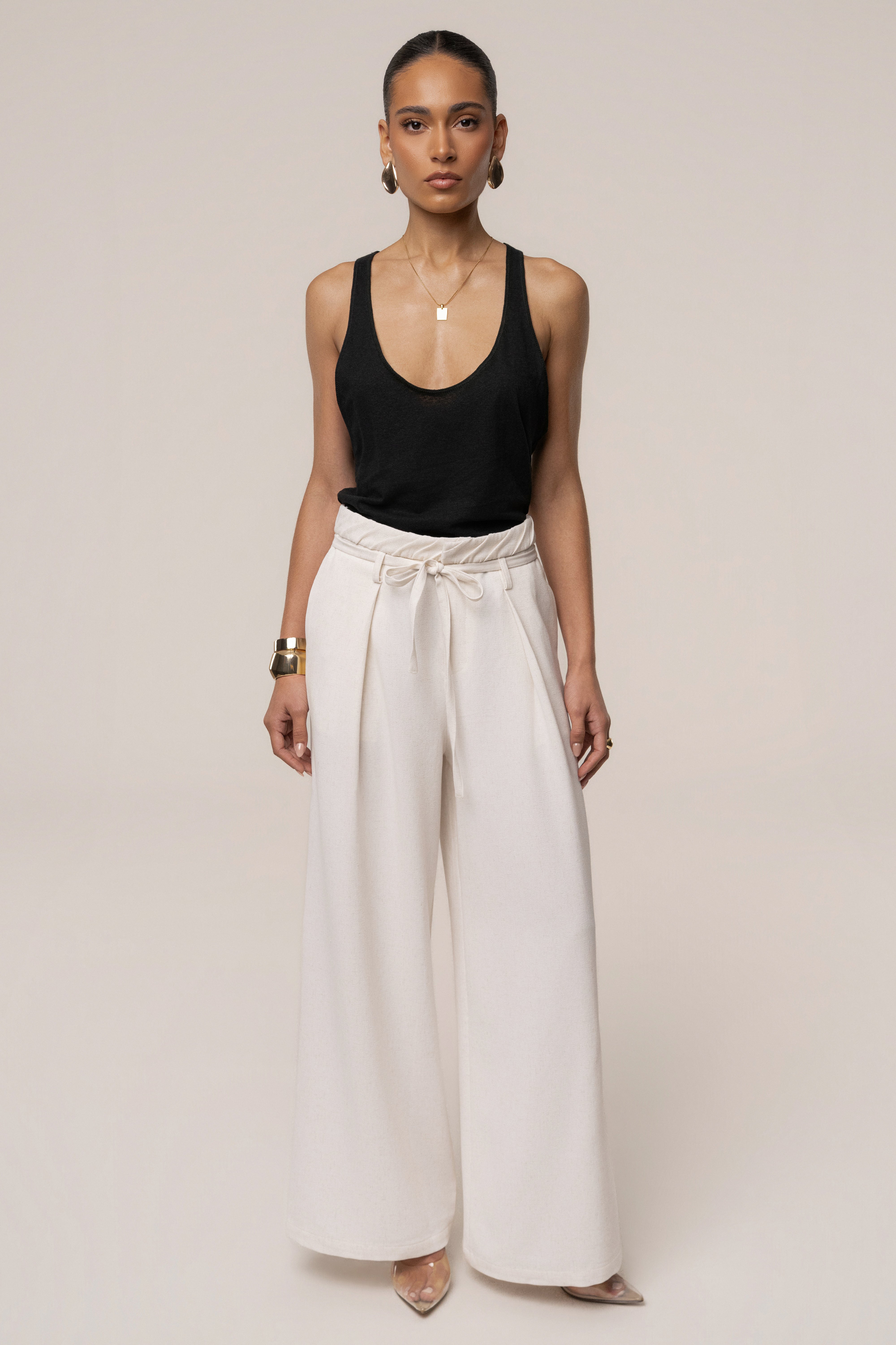 Ivory JLUXLABEL refined ease wide-leg pants, stylish bottoms with a relaxed fit and high waist, laid flat on a white background.