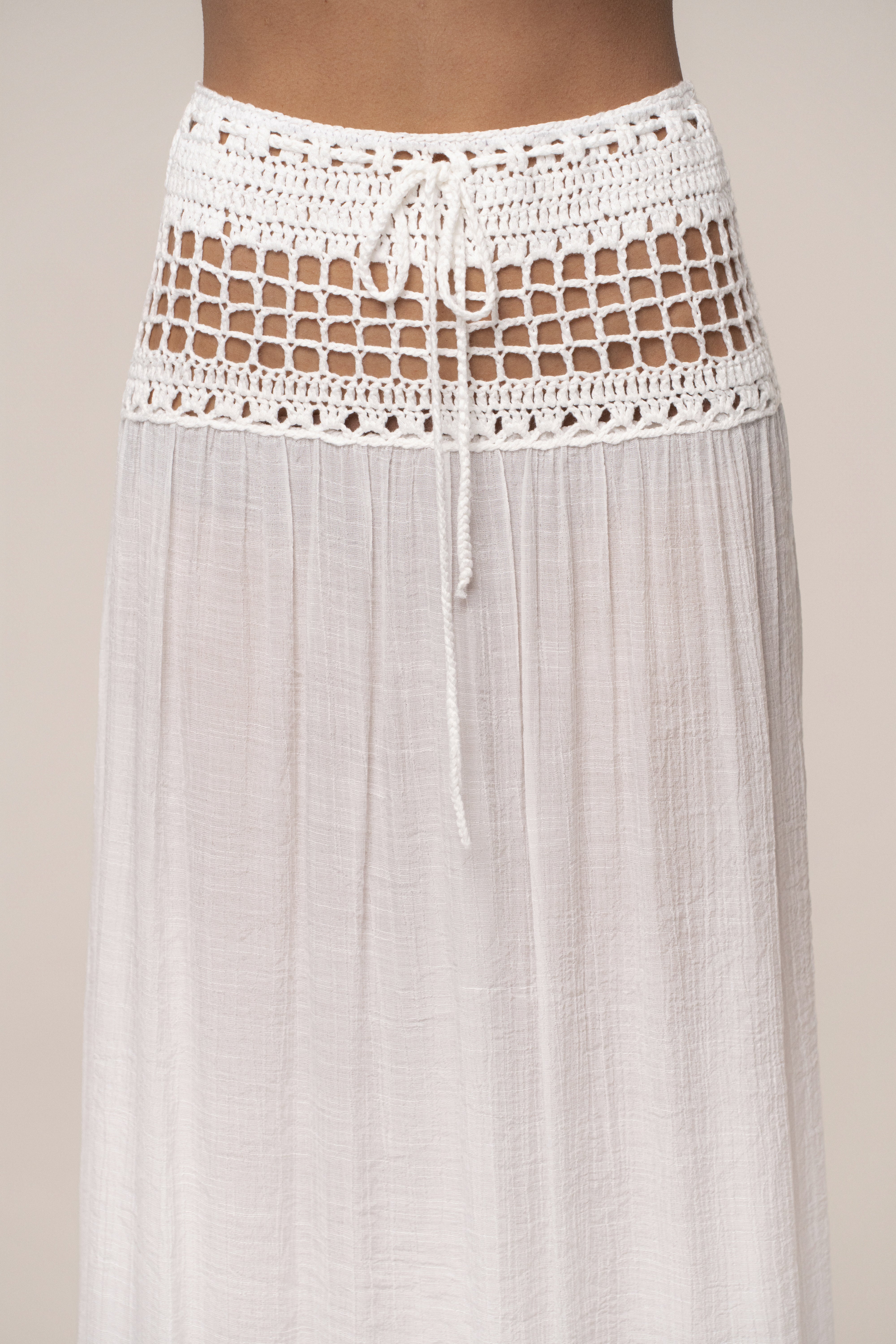 Ivory resort crochet maxi skirt by JLUXLABEL, featuring a flowy design and intricate crochet details perfect for warm-weather style.