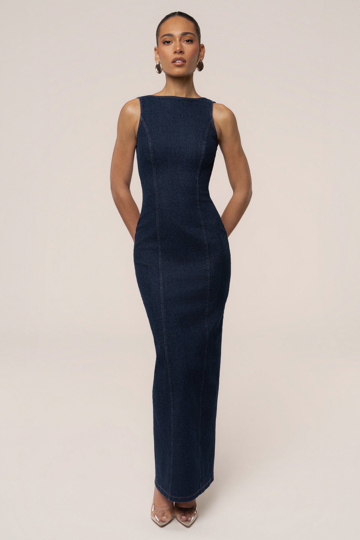 Dark denim JLUXLABEL sculpt maxi dress displayed on a model, showcasing its fitted silhouette and stylish design.