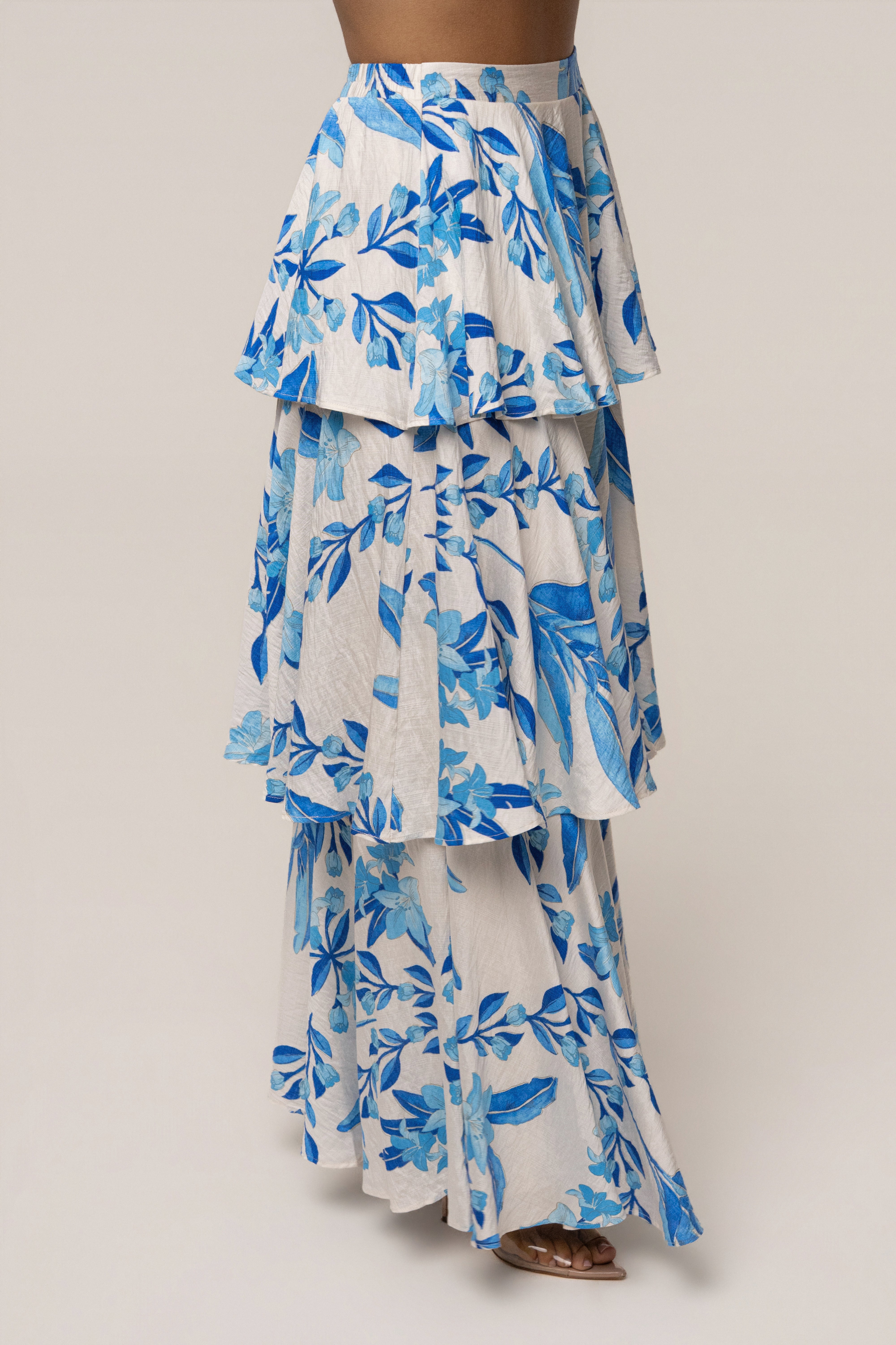Blue floral jasmine ruffle maxi skirt by JLUXLABEL, featuring a flowy design with ruffle details and vibrant floral print.