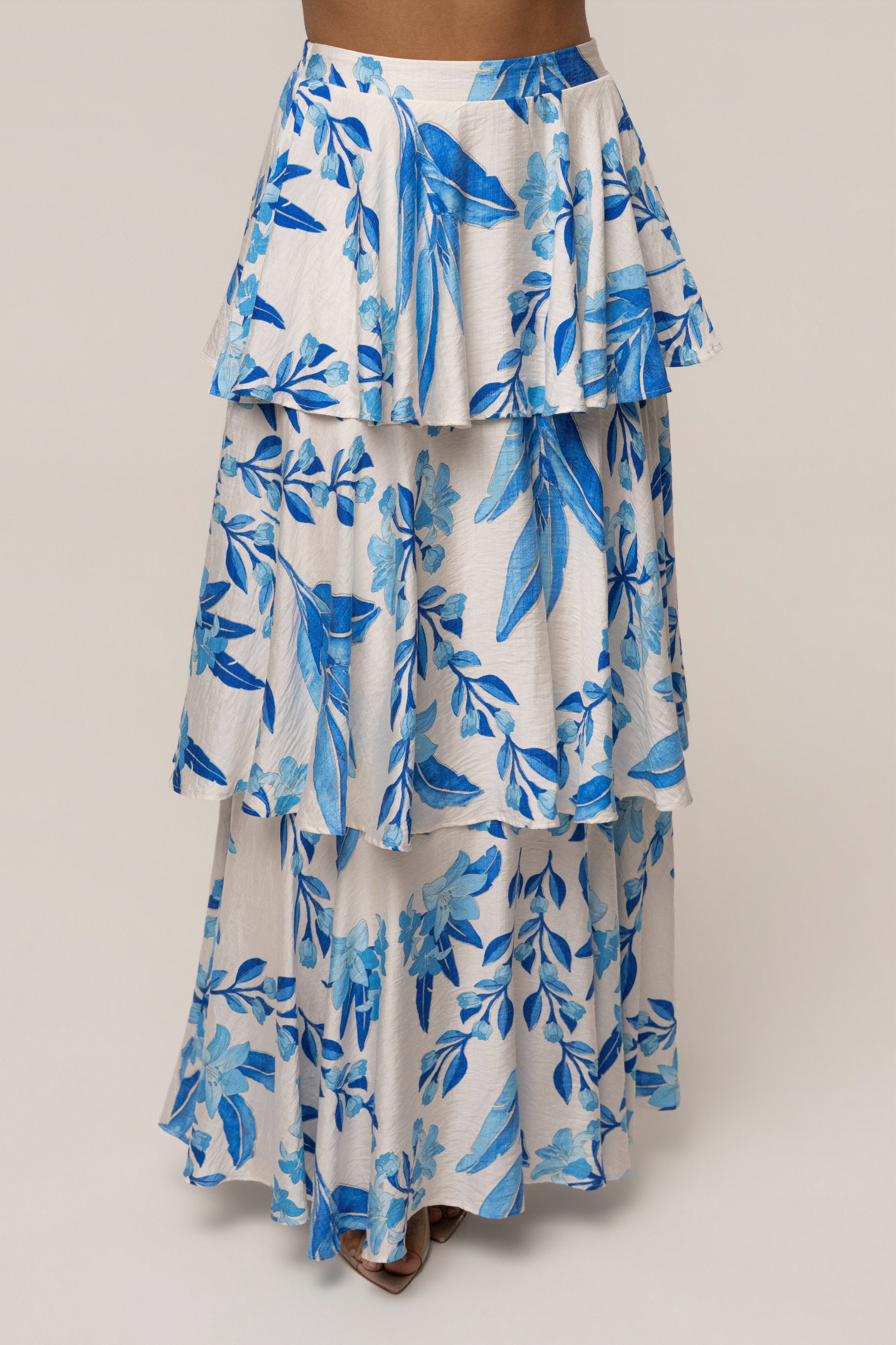 Blue floral Jasmine ruffle maxi skirt by JLUXLABEL featuring a flowing design and floral pattern, perfect for summer or casual wear.